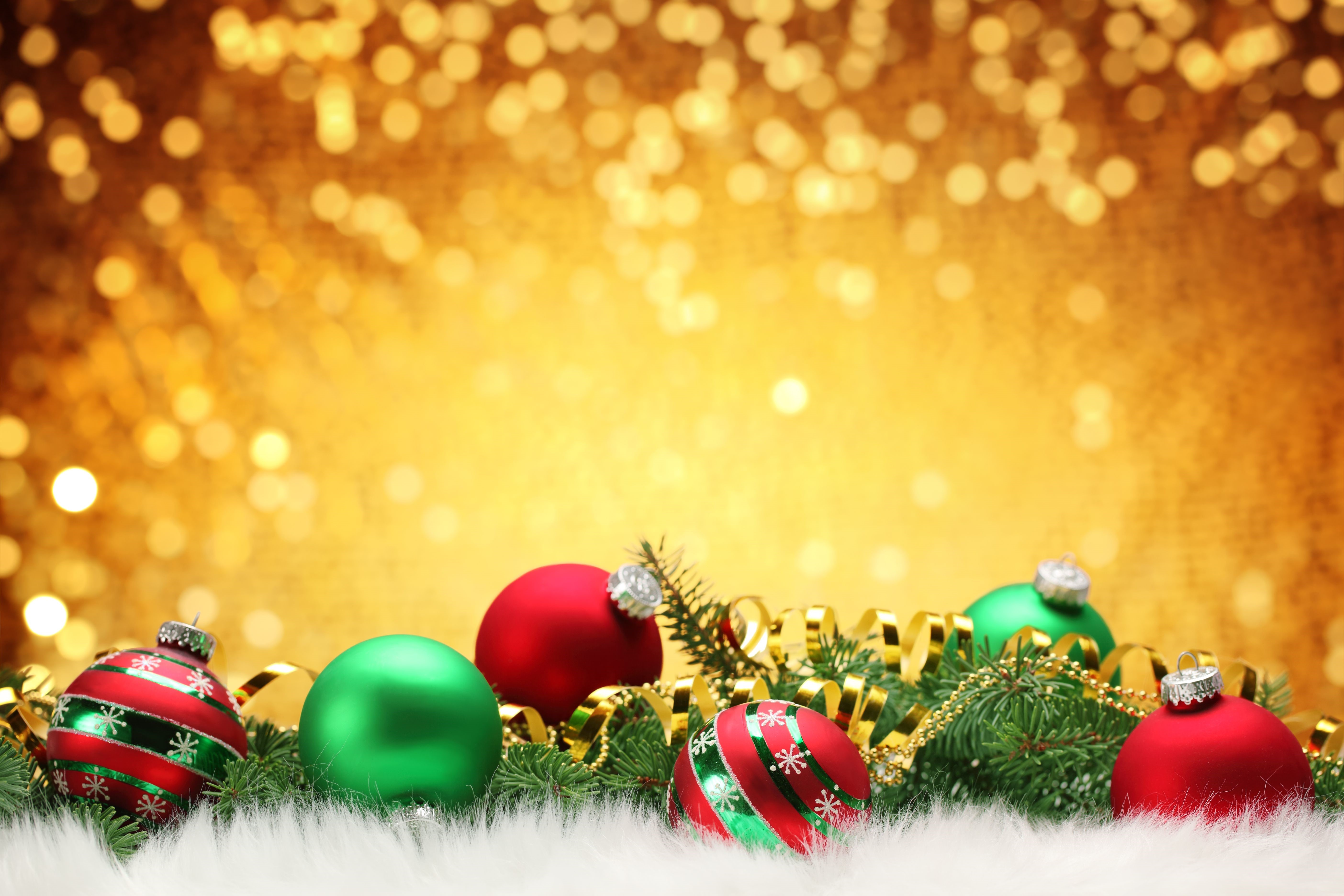 Christmas ornaments on a golden bokeh background HD Wallpaper