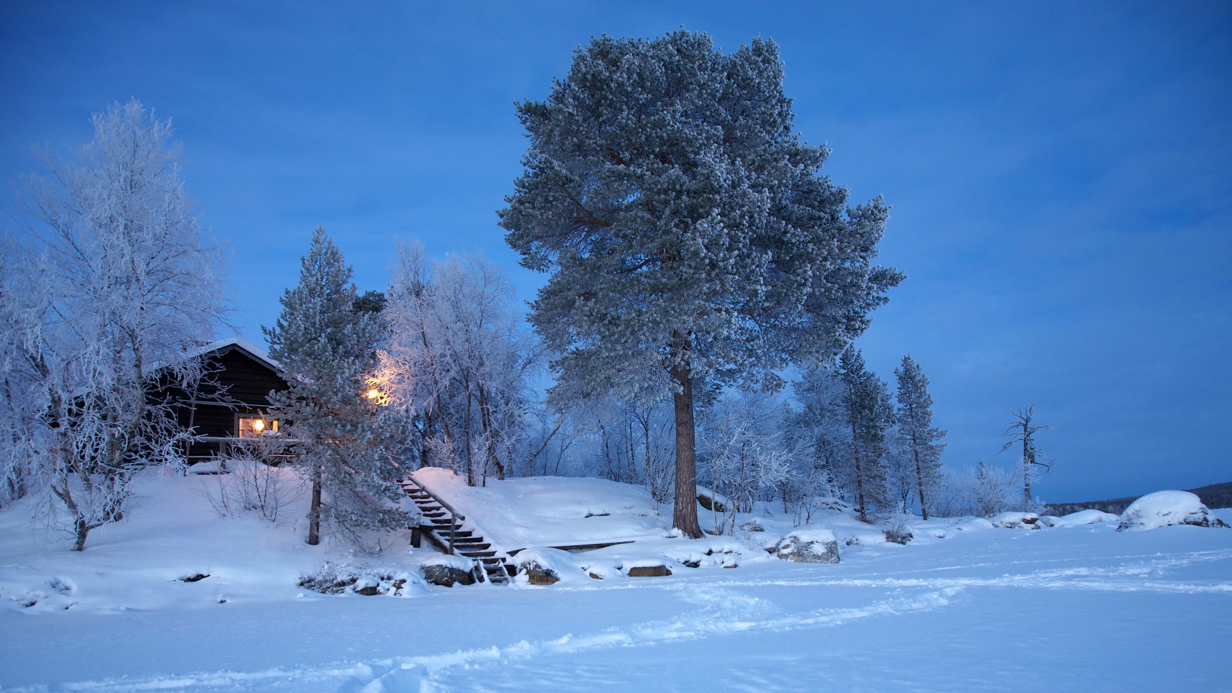 Winter cabin in snowy Finland HD Wallpaper