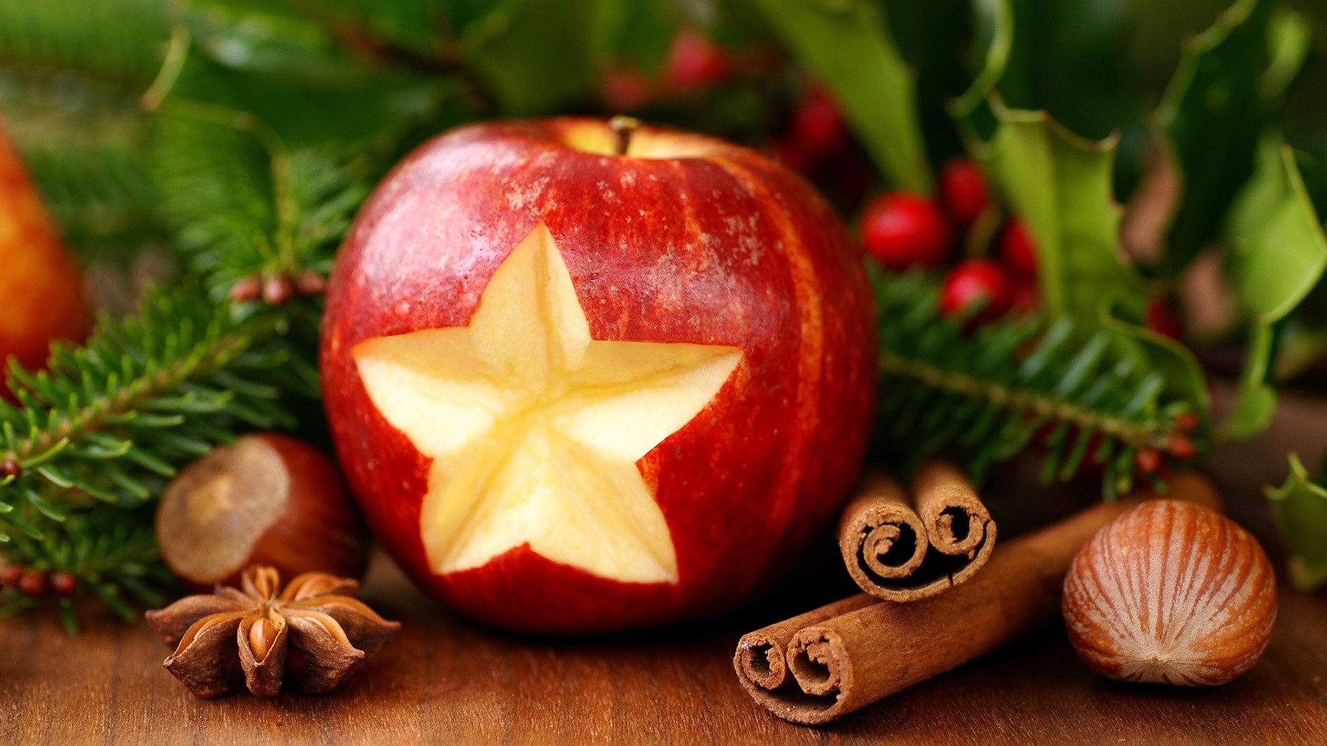 Apple with star carving and Christmas decorations HD Wallpaper
