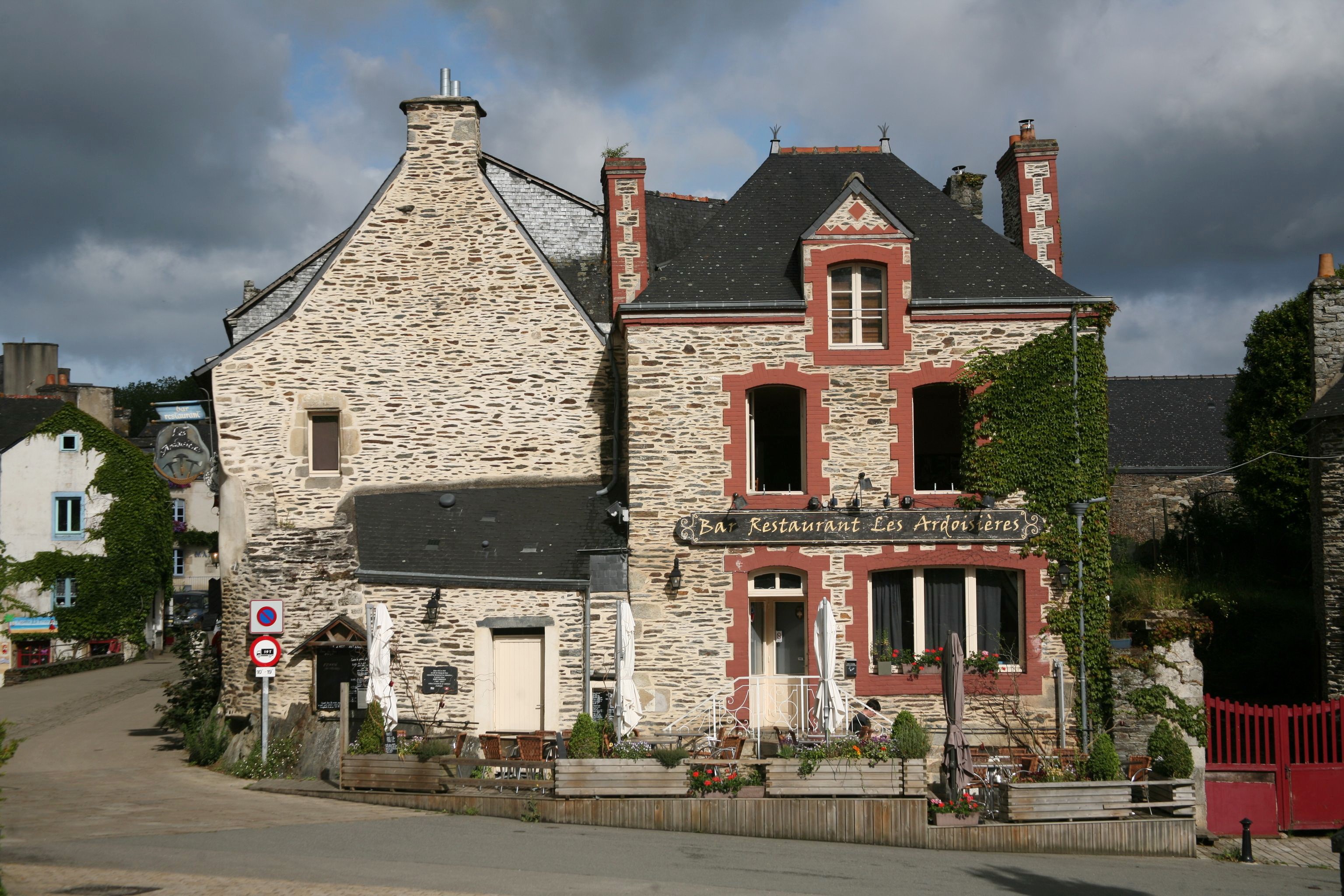Stone buildings with restaurant in Morbihan, Bretagne, France HD Wallpaper
