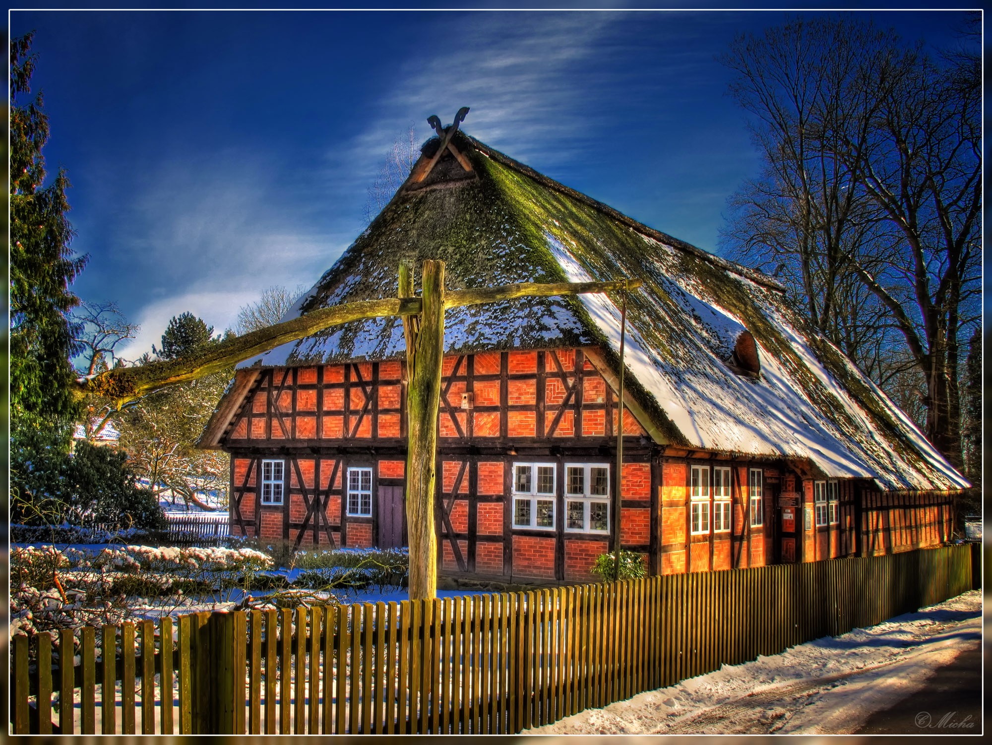 Half-timbered house with thatched roof in Germany HD Wallpaper