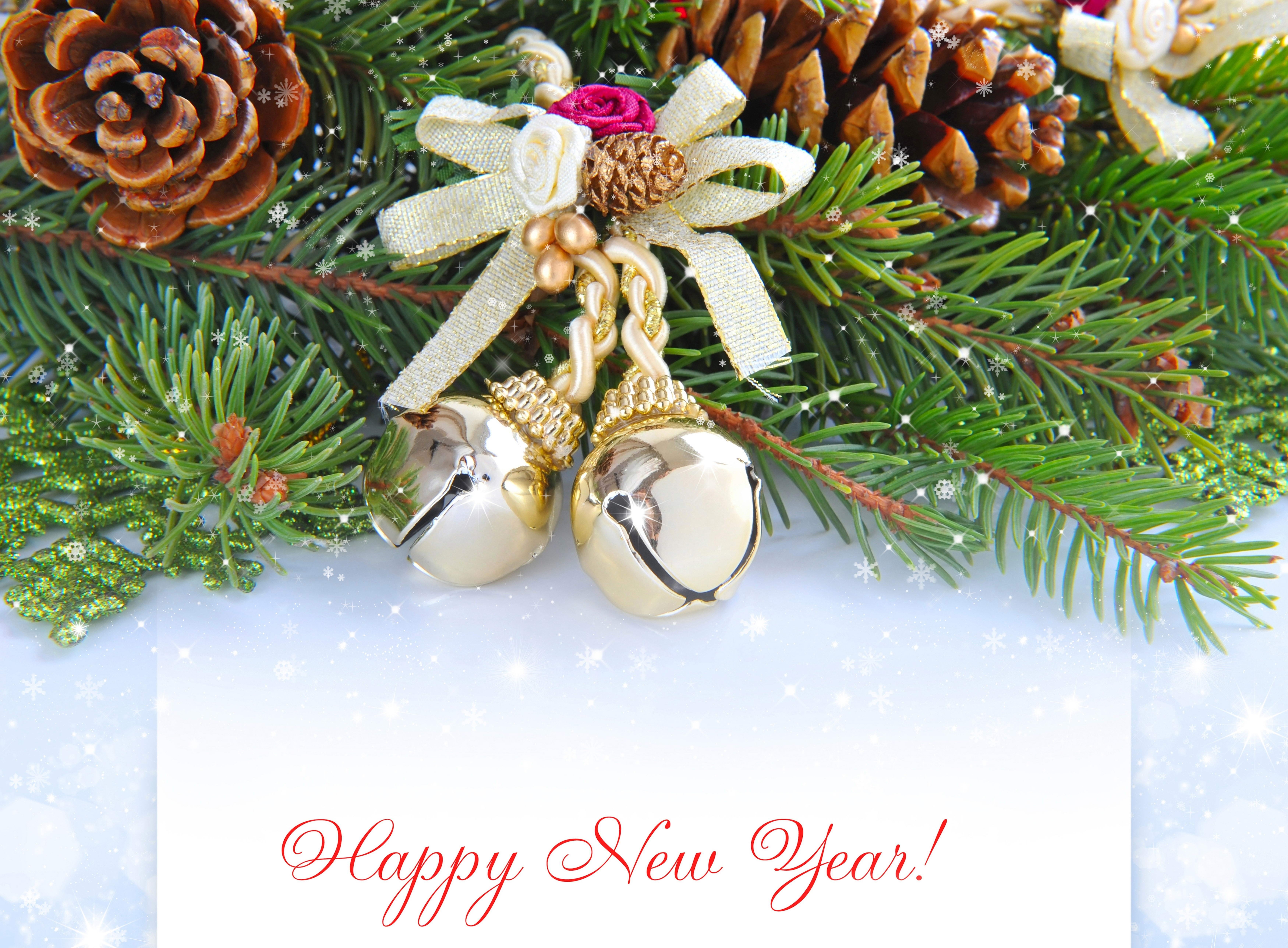 Christmas pine branches with bells and Happy New Year text HD Wallpaper