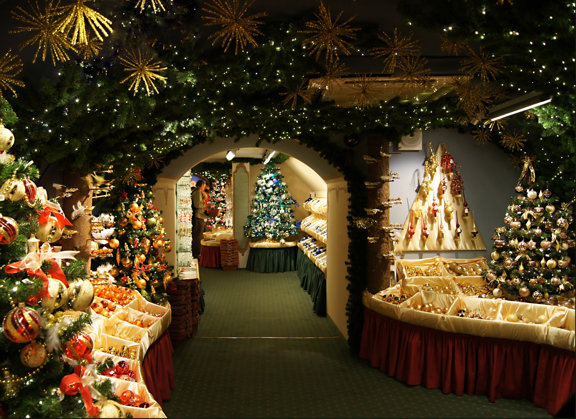 Christmas store interior with decorated trees and ornaments HD Wallpaper