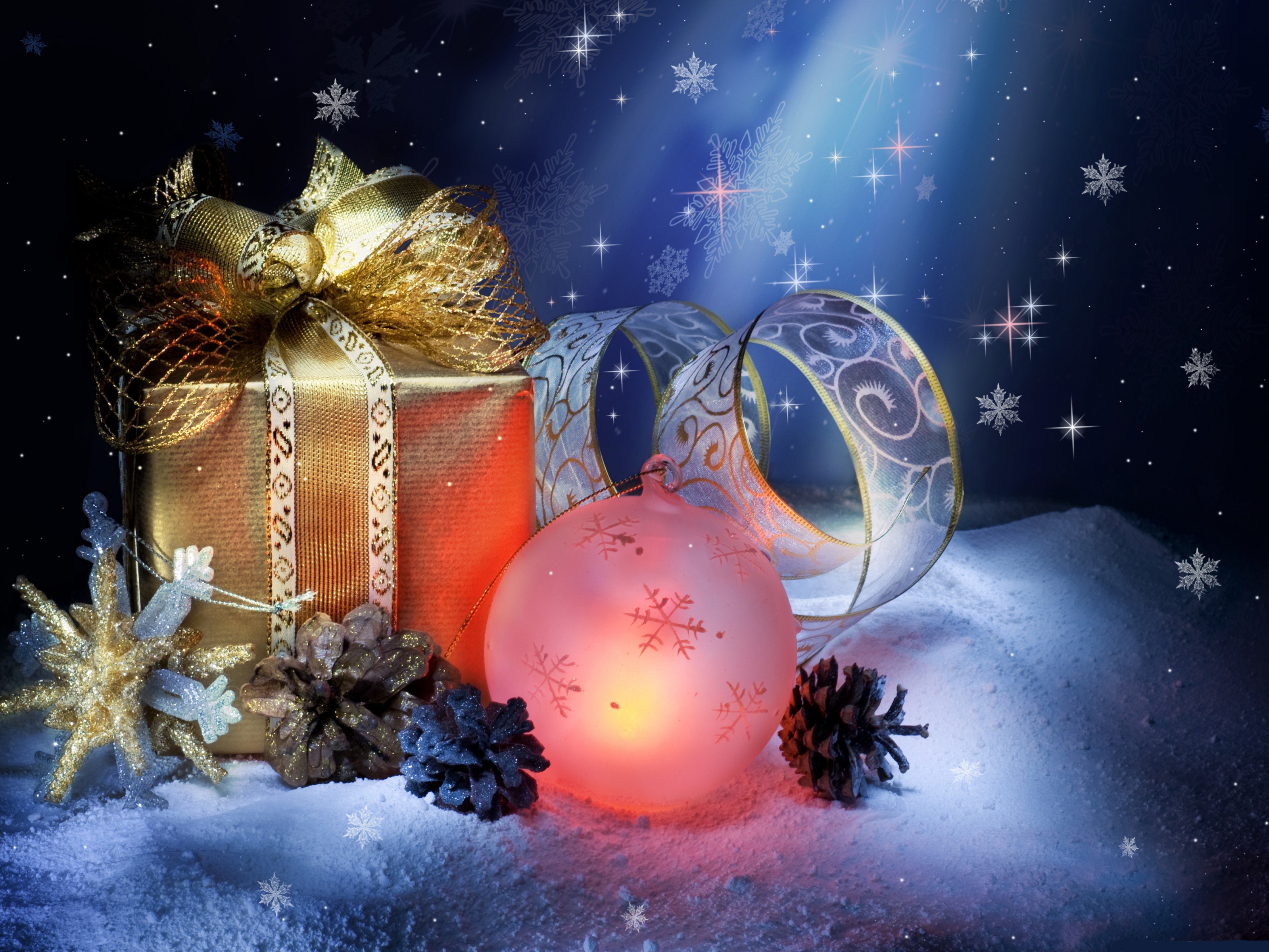 Christmas gift with ornaments and pine cones in snow HD Wallpaper