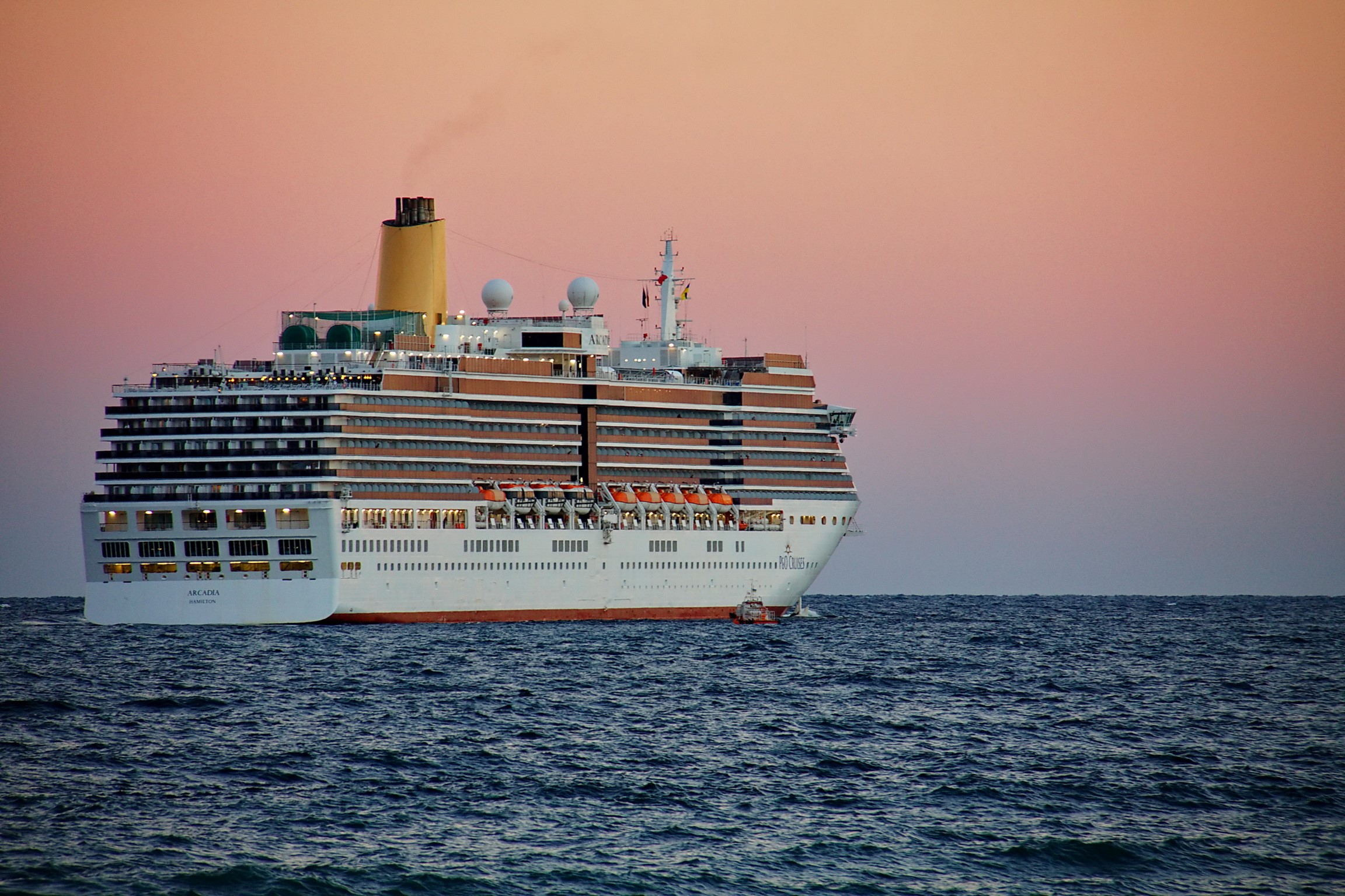 Cruise liner Arcadia sailing on the ocean at sunset HD Wallpaper
