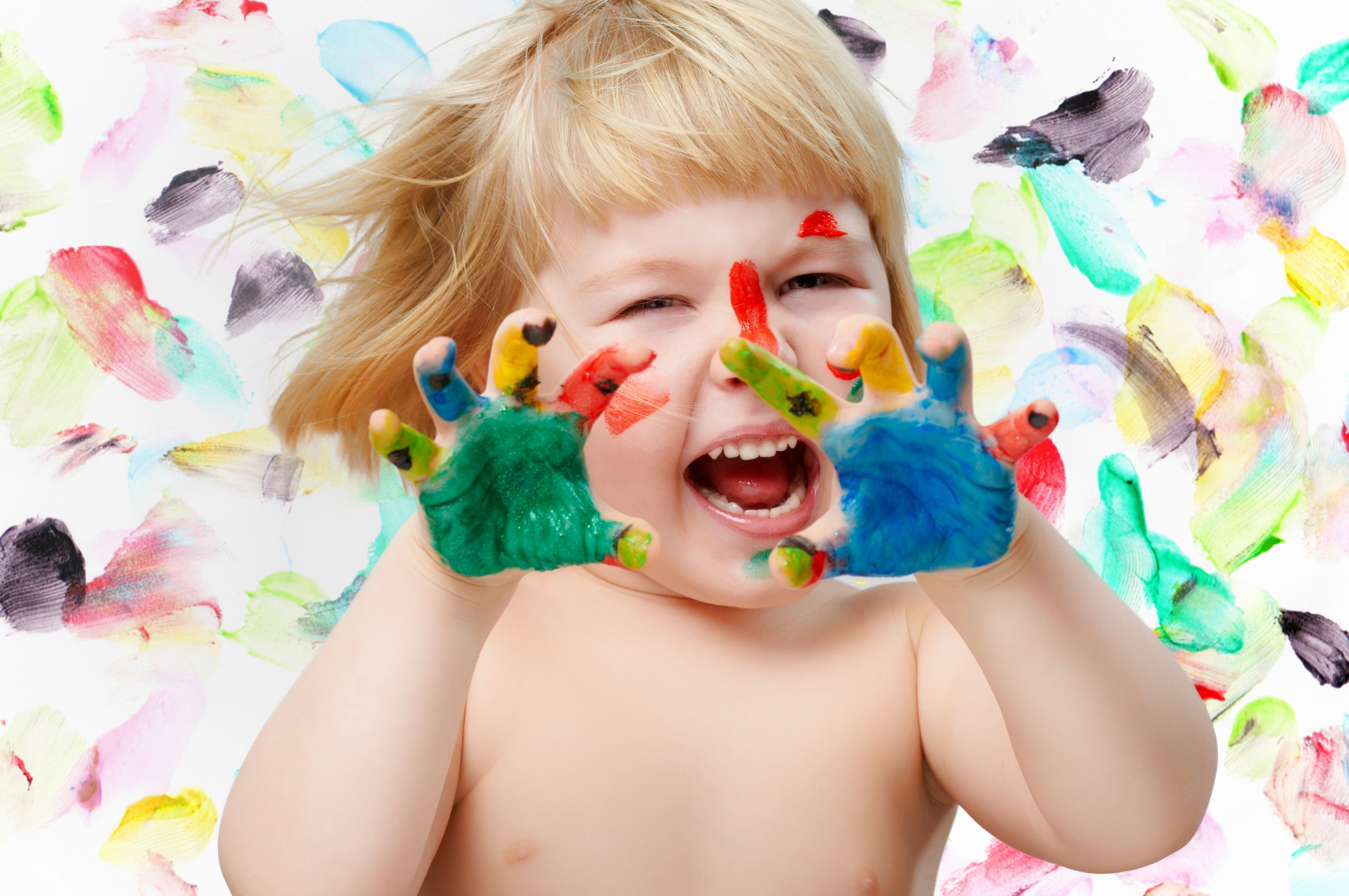 Little girl with painted hands and face HD Wallpaper