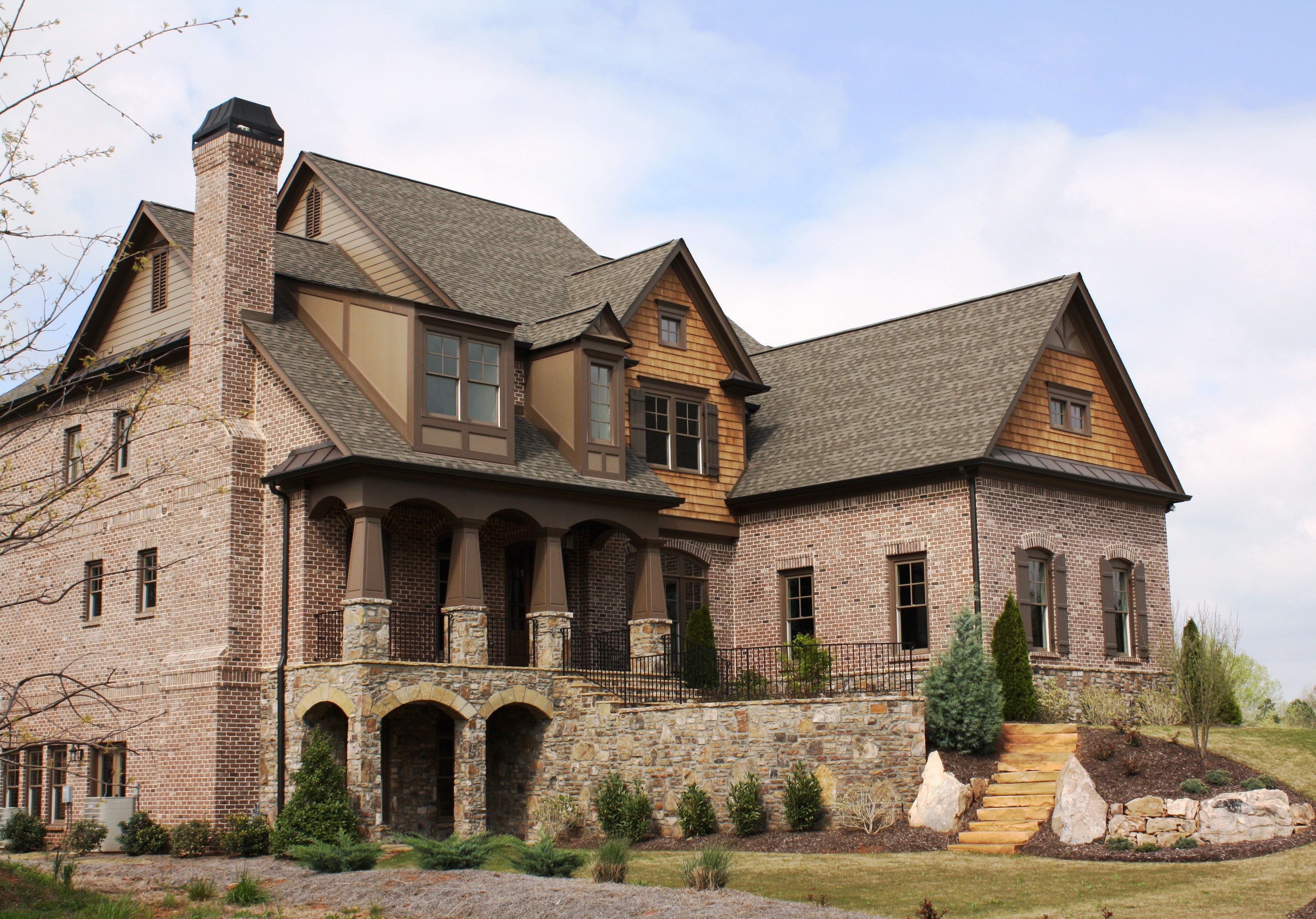 Brick Mansion with Stone Accents and Landscaping HD Wallpaper