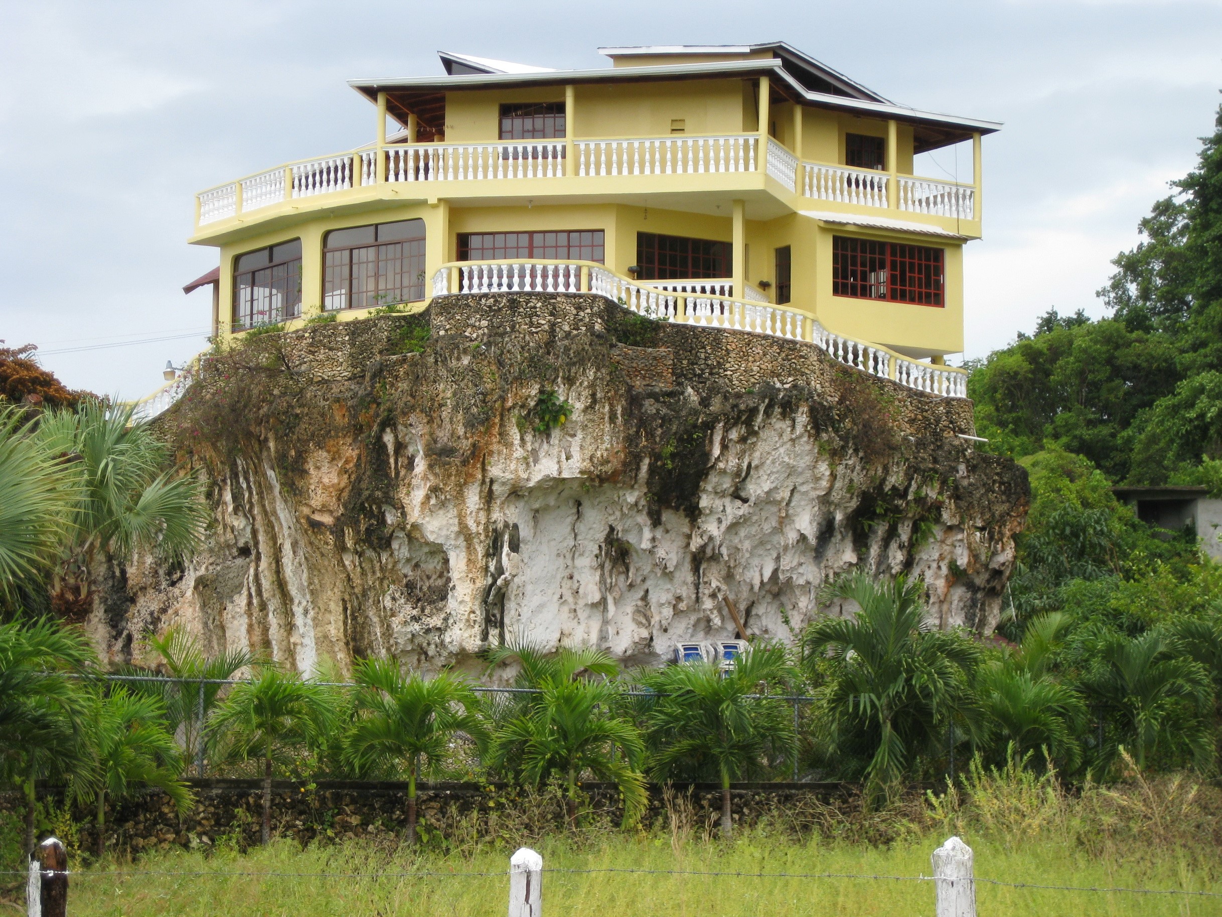 Yellow mansion on a cliff in Cabrera, Dominican Republic HD Wallpaper