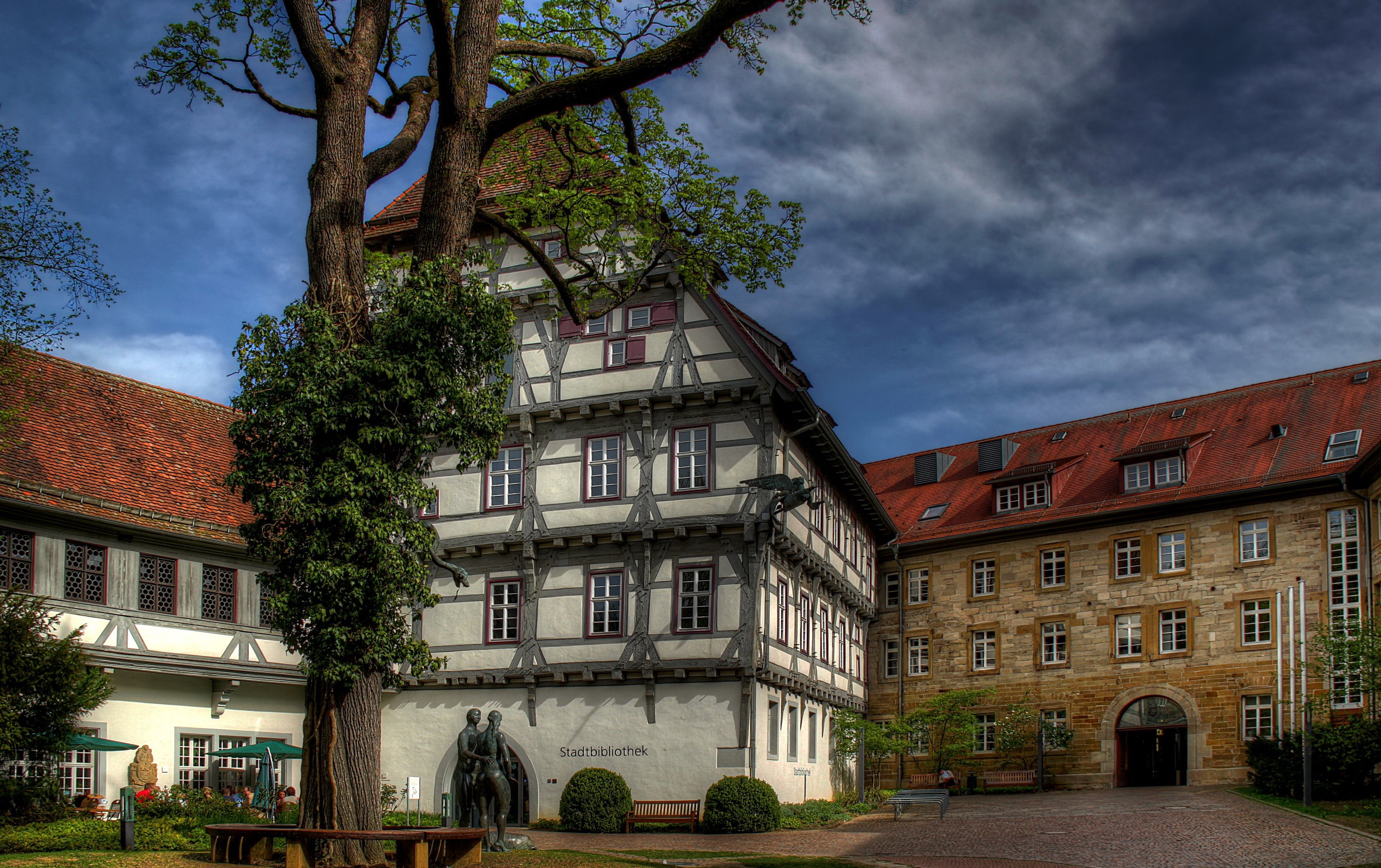Half-timbered building and stone building in Munchingen, Germany HD Wallpaper