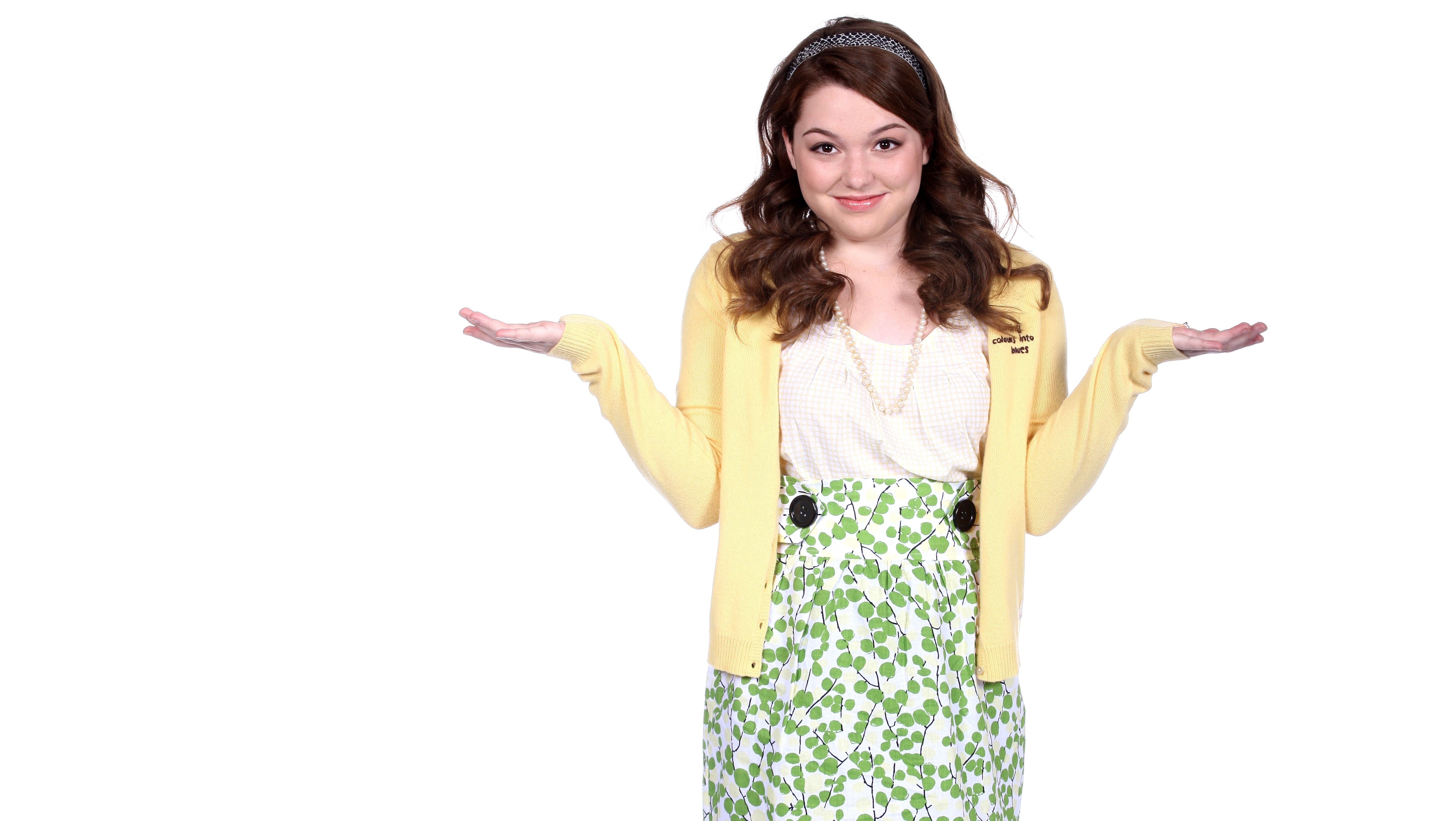 Jennifer Stone smiling with hands outstretched HD Wallpaper