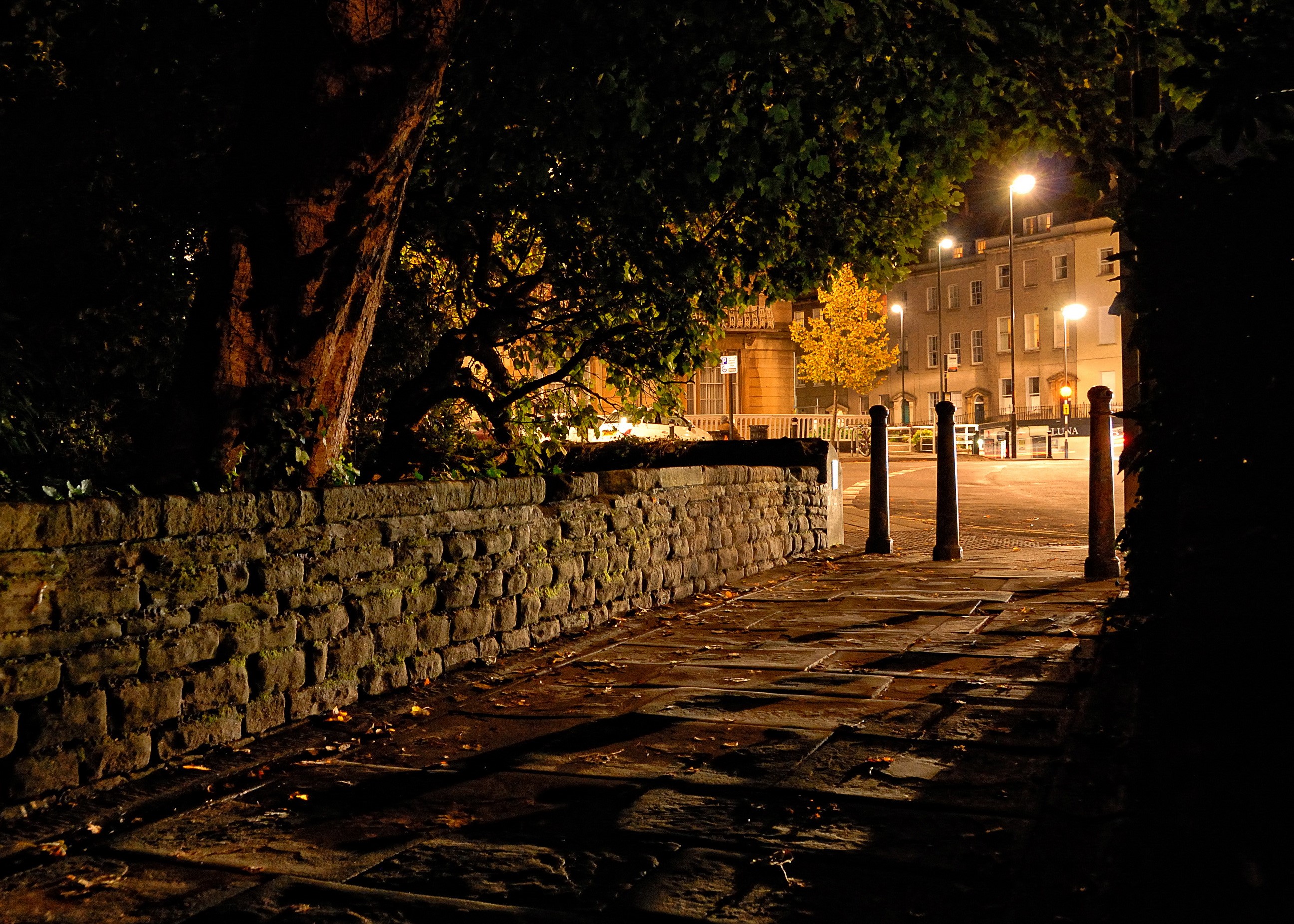 Street at night with stone wall and street lights in Clifton, Bristol HD Wallpaper