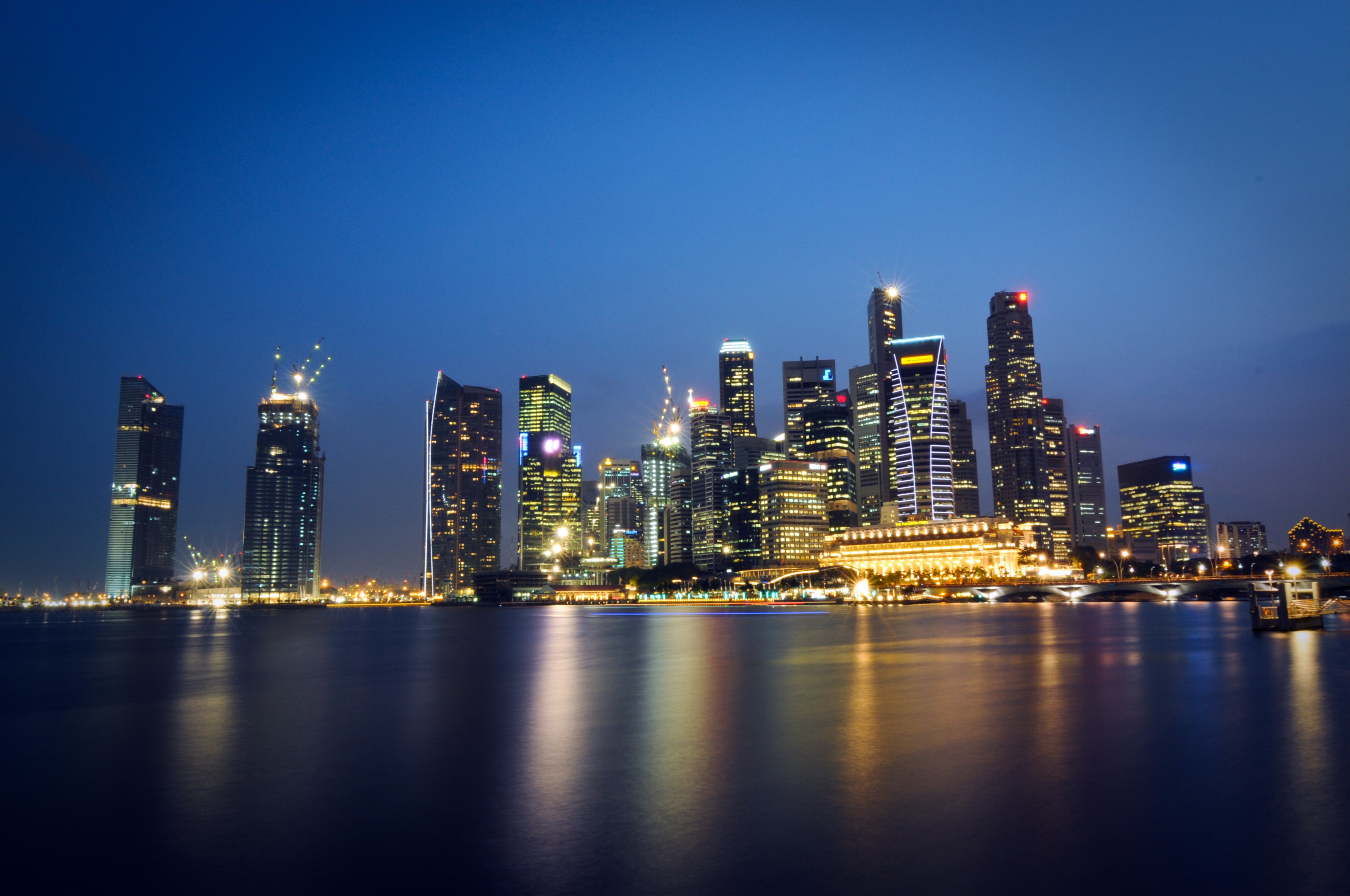 Singapore skyscrapers at night over water HD Wallpaper
