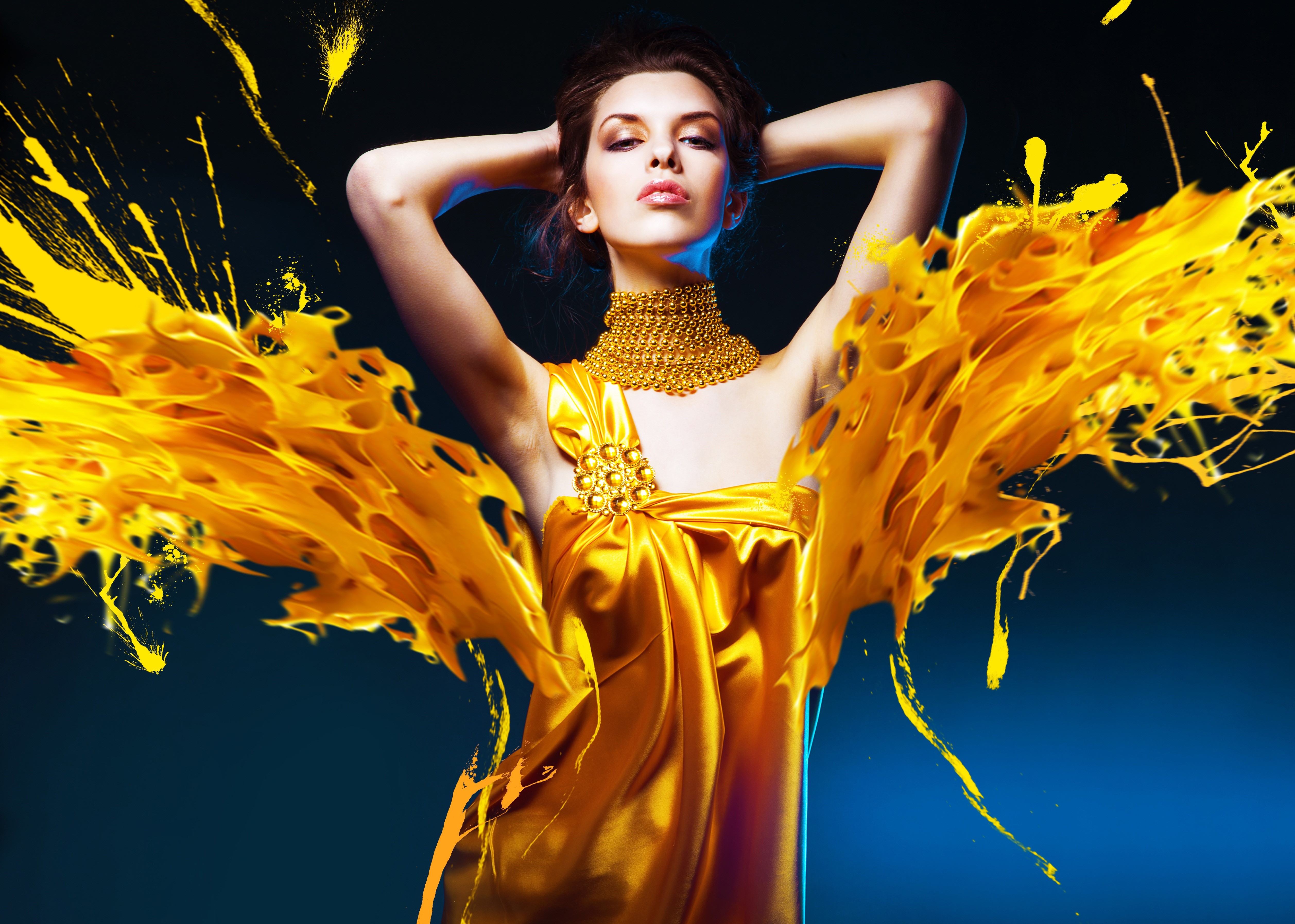 Brunette girl in gold dress with yellow splashes HD Wallpaper
