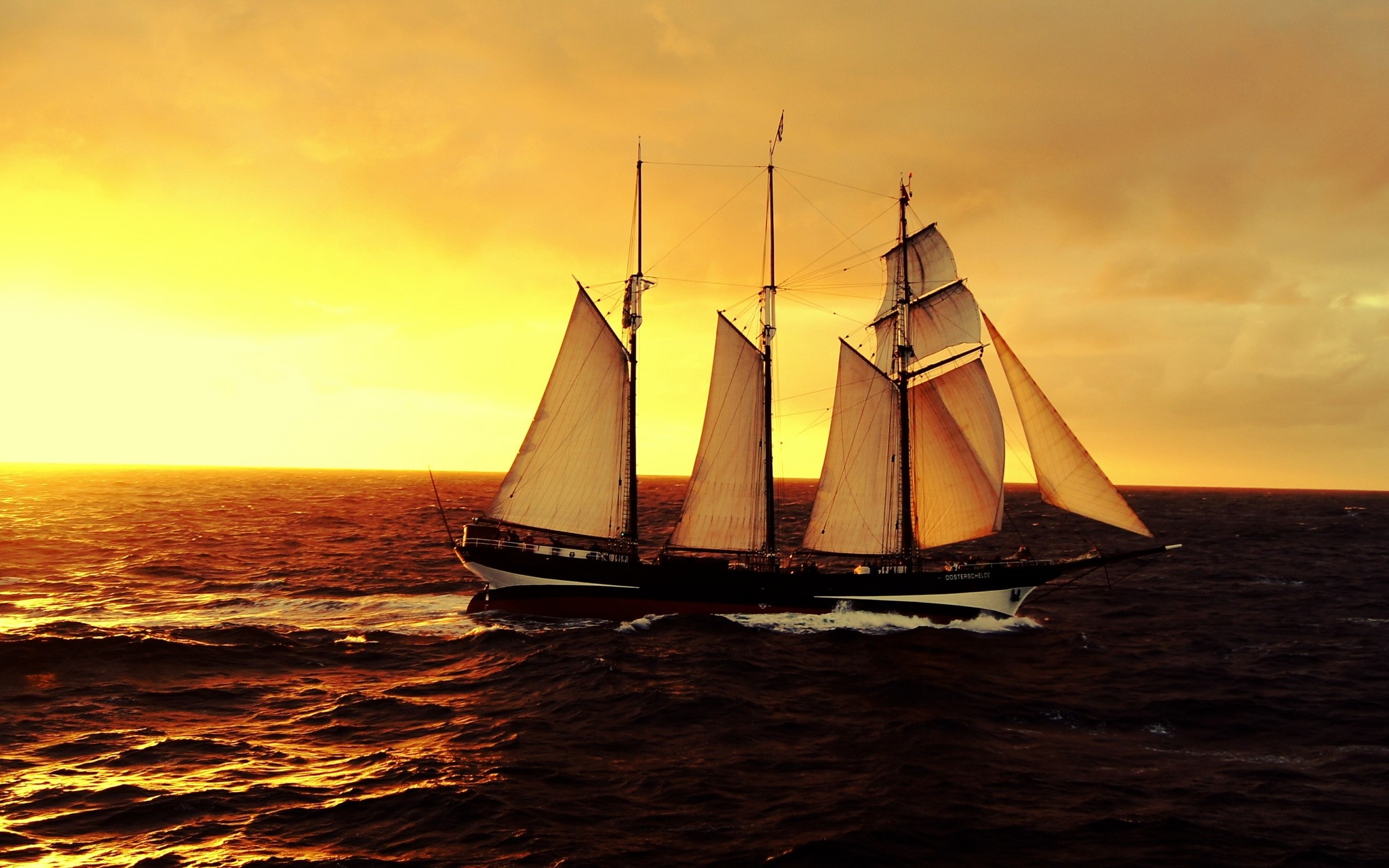 Sailboat on the sea during sunset HD Wallpaper