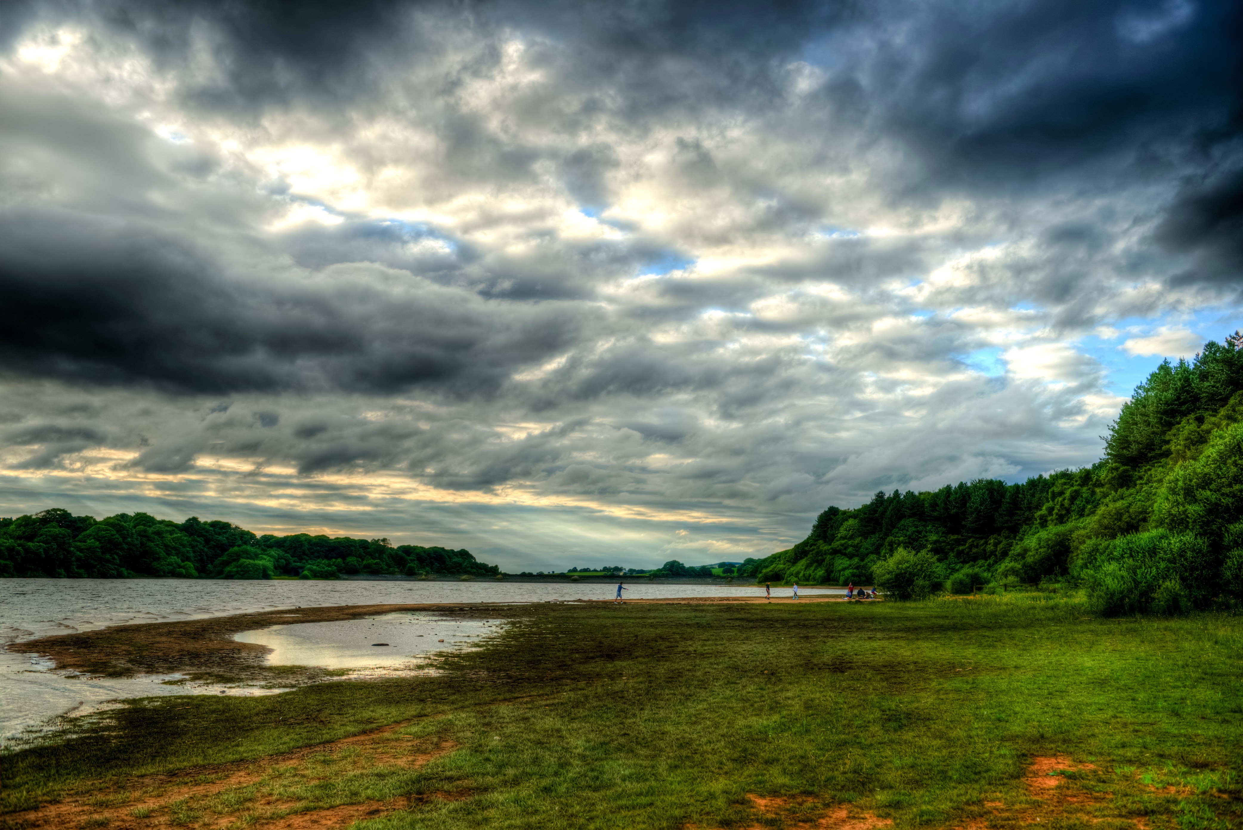 River and grassy shore under cloudy sky HD Wallpaper