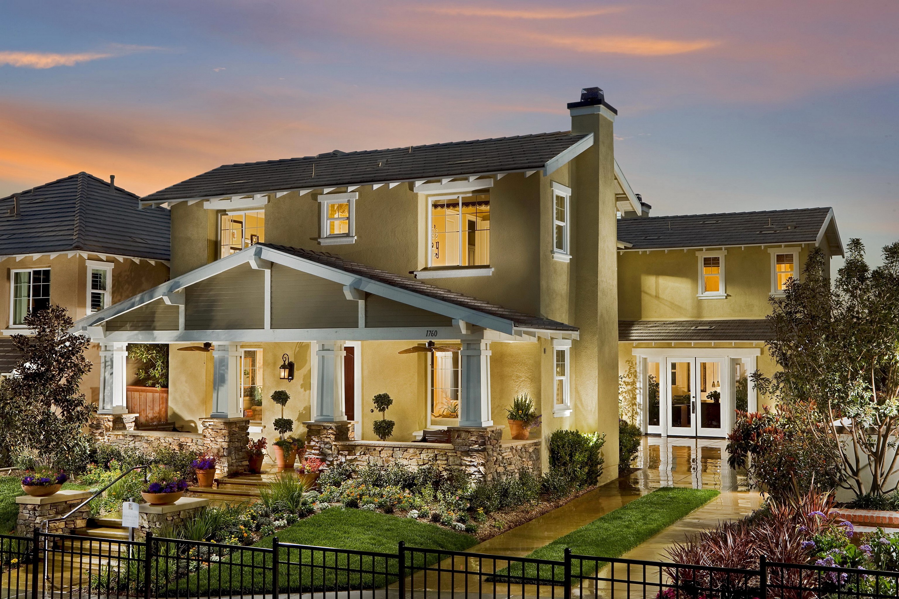 Two-story house with porch and landscaping HD Wallpaper