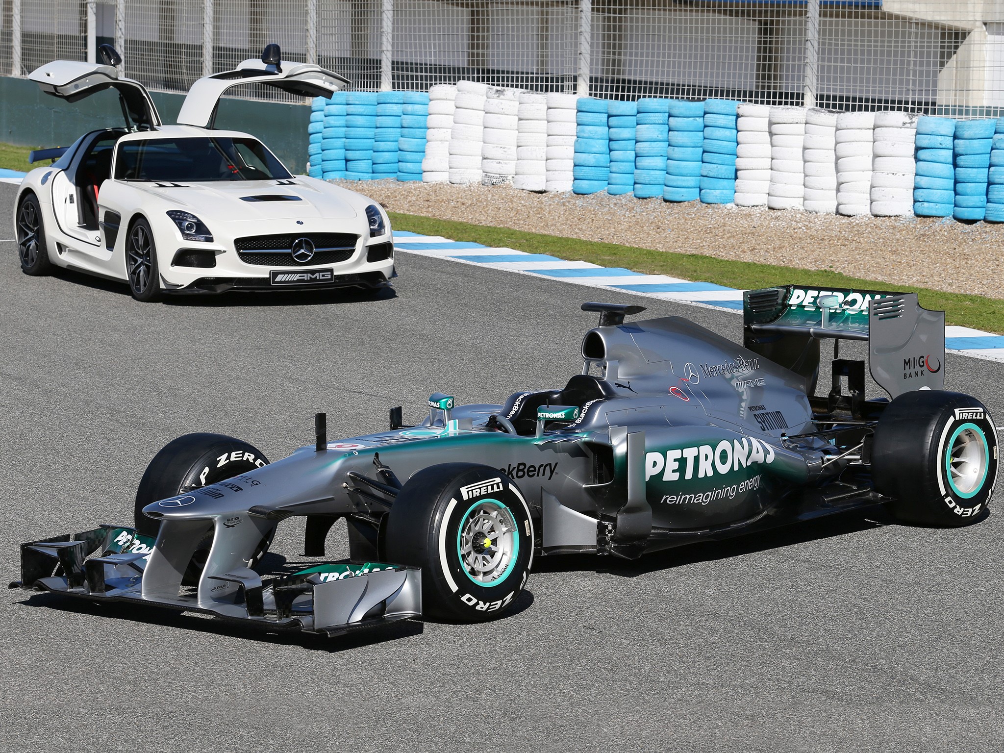 Mercedes SLS AMG and Mercedes F1 W04 Formula 1 car HD Wallpaper