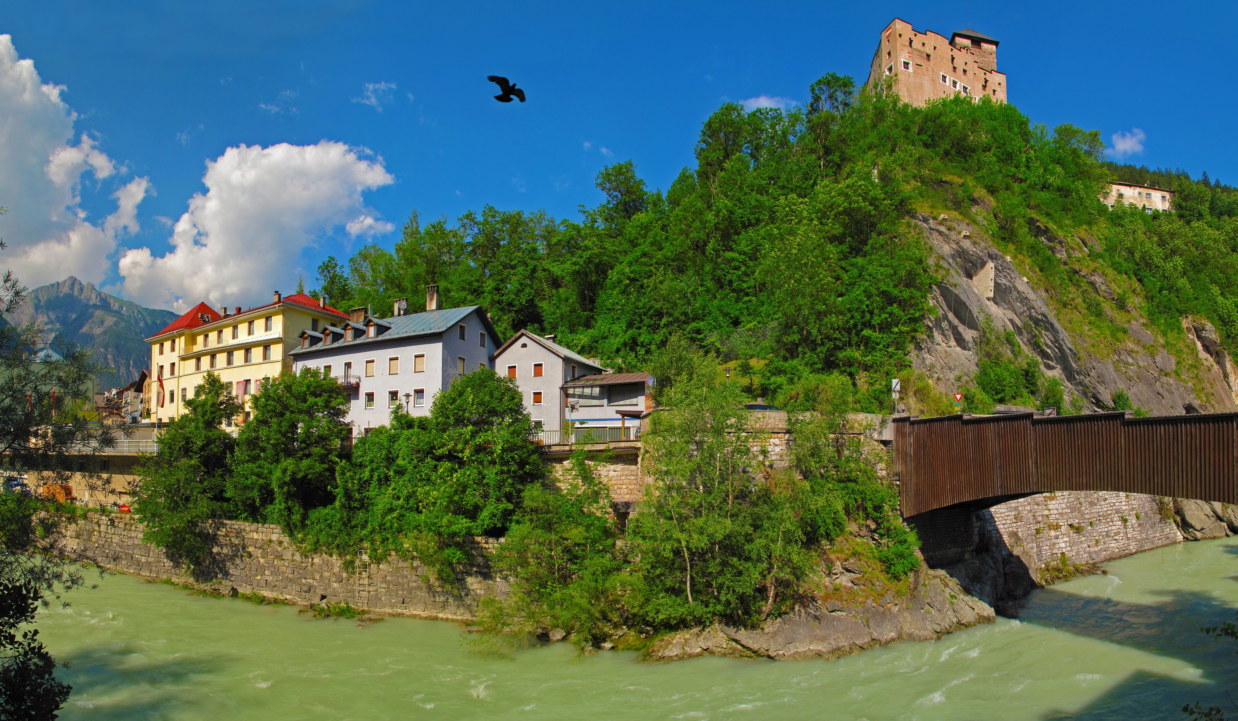 Castle on a hill above a river and town in Austria HD Wallpaper
