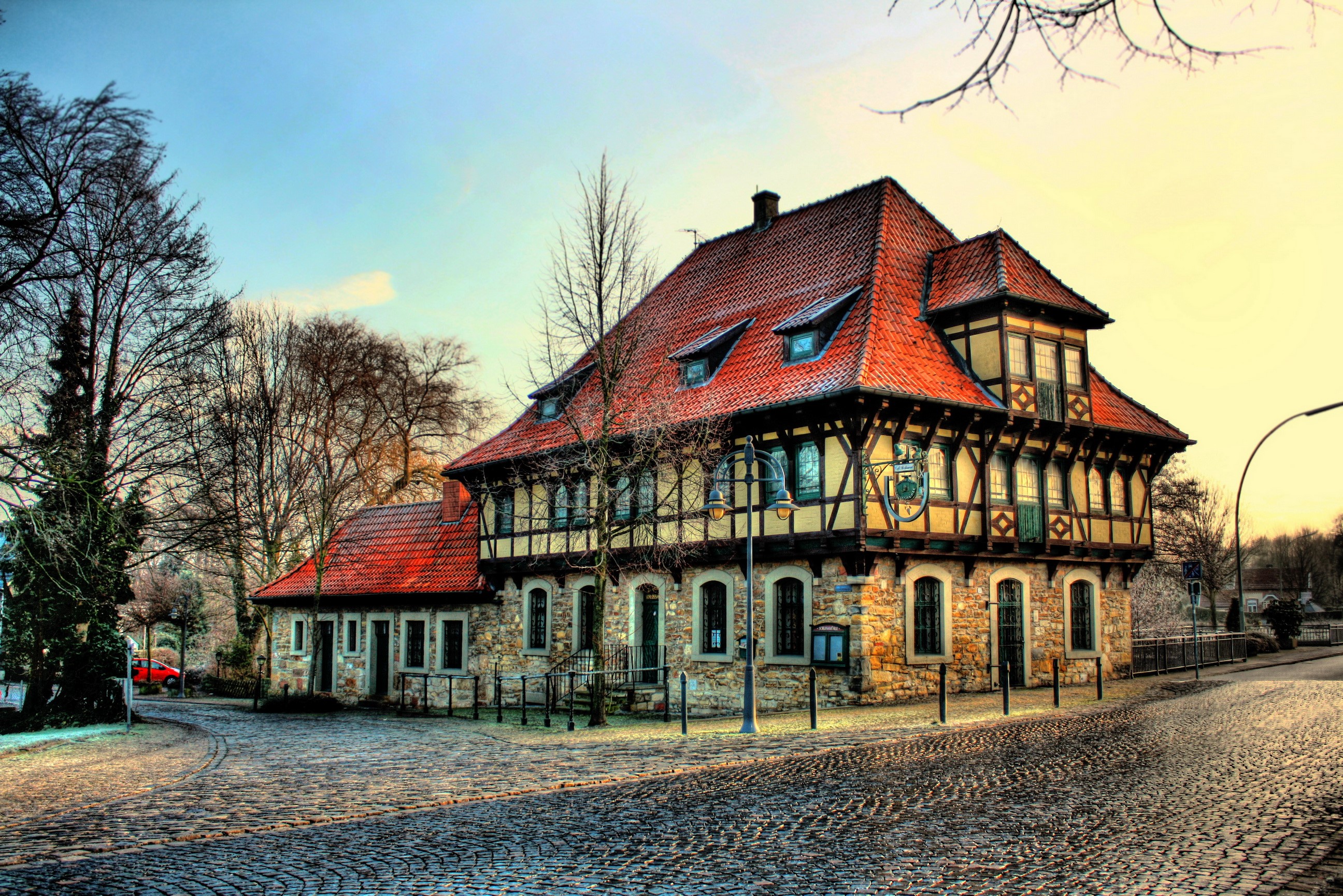 Half-timbered house in Steinfurt, Germany with cobblestone street HD Wallpaper