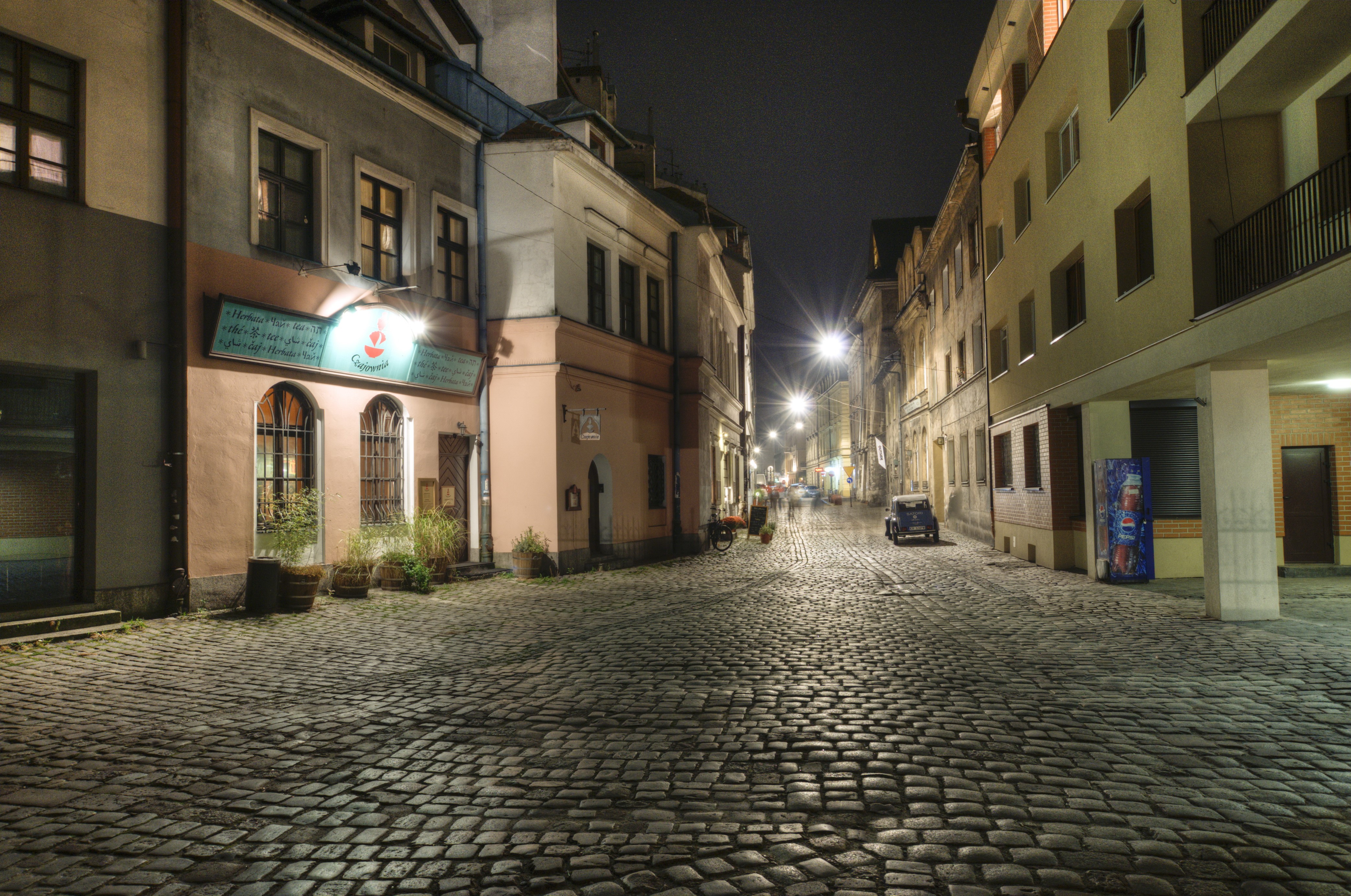 Night street in Krakow, Poland with cobblestone road HD Wallpaper