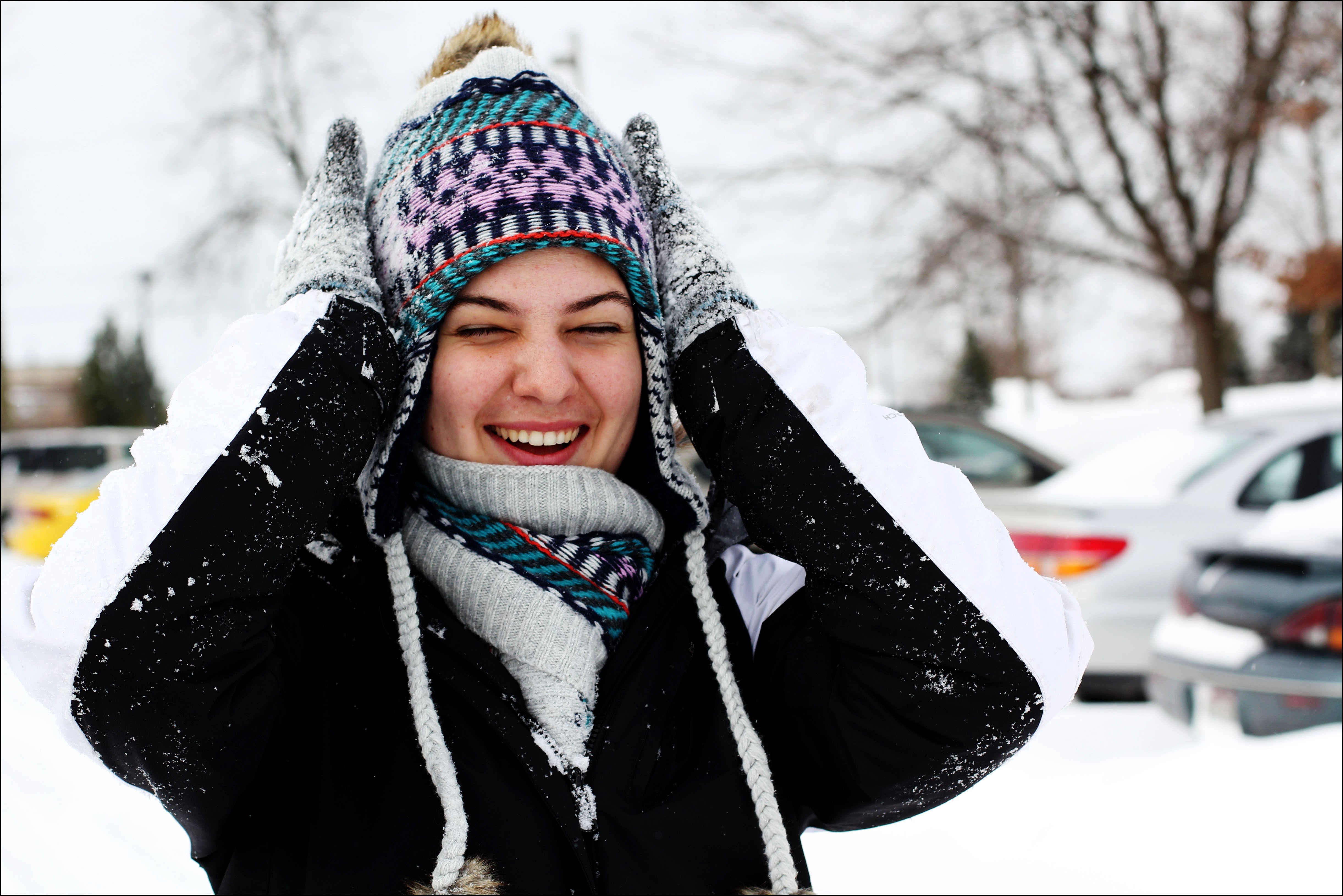 Woman laughing in the snow HD Wallpaper