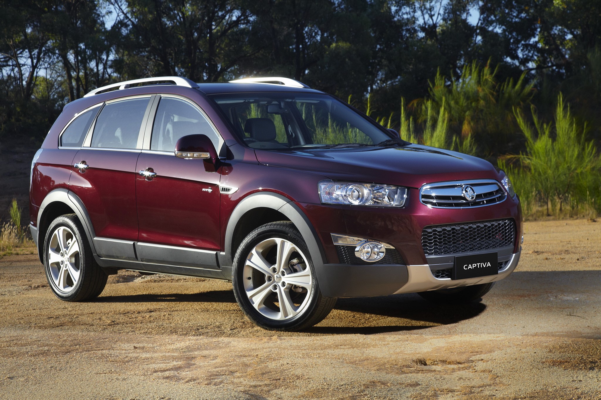 Holden Captiva SUV parked on dirt road HD Wallpaper