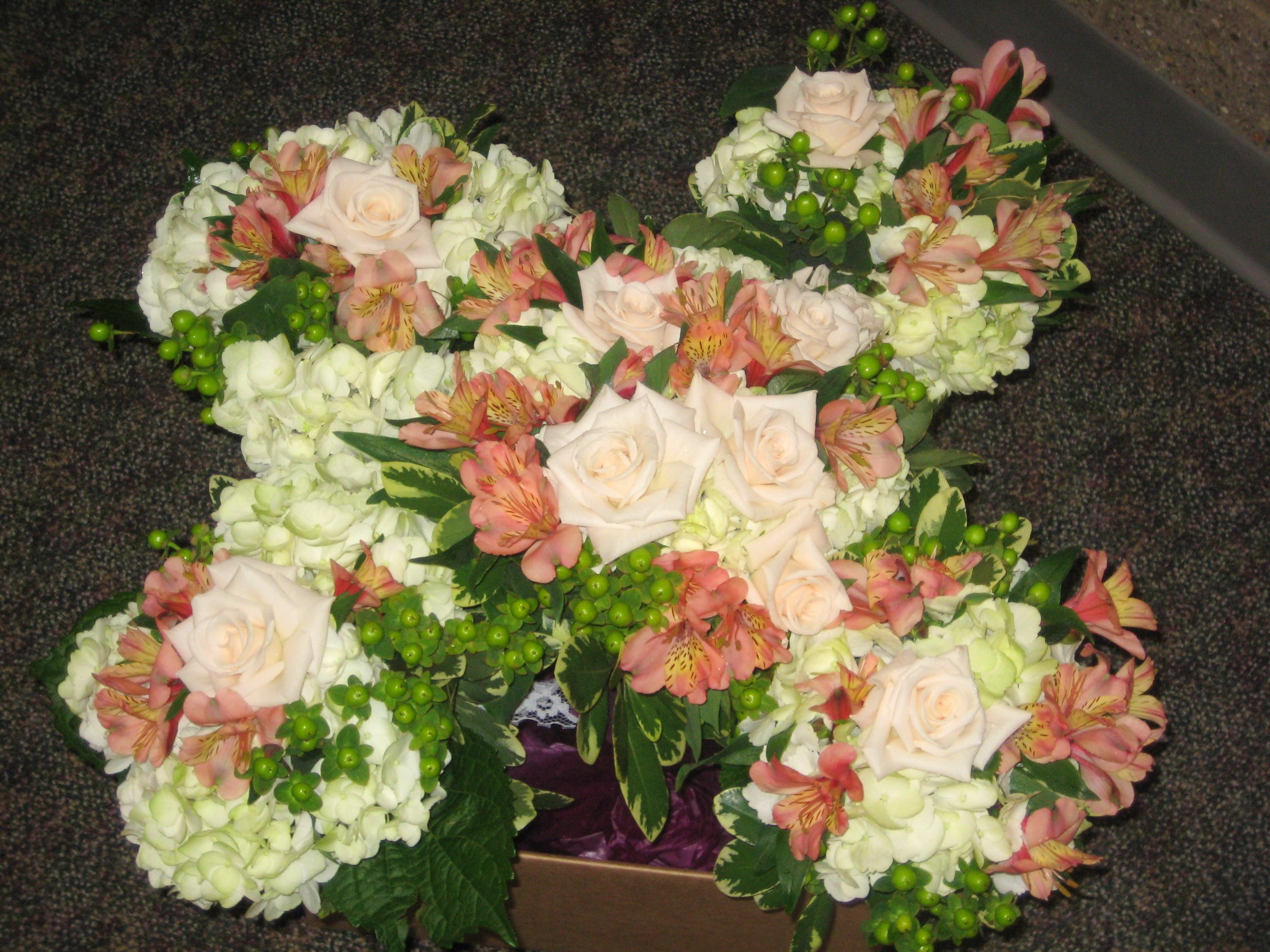 Butterfly shaped floral arrangement with roses and alstroemeria HD Wallpaper
