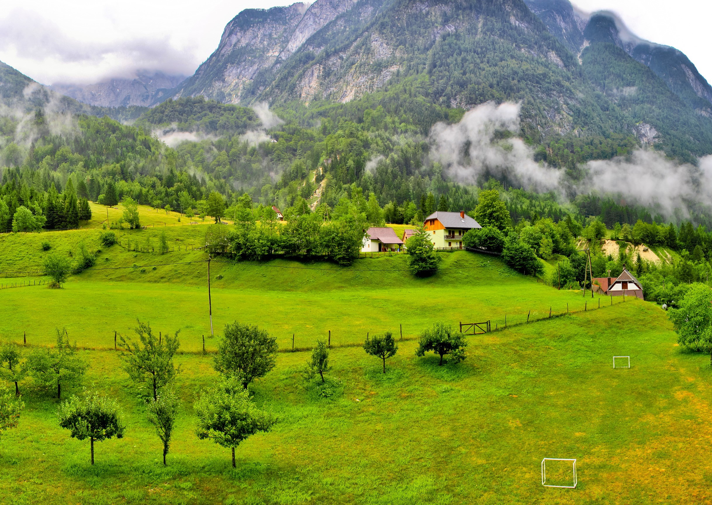 Green valley with houses and mountains in Bovec, Slovenia HD Wallpaper