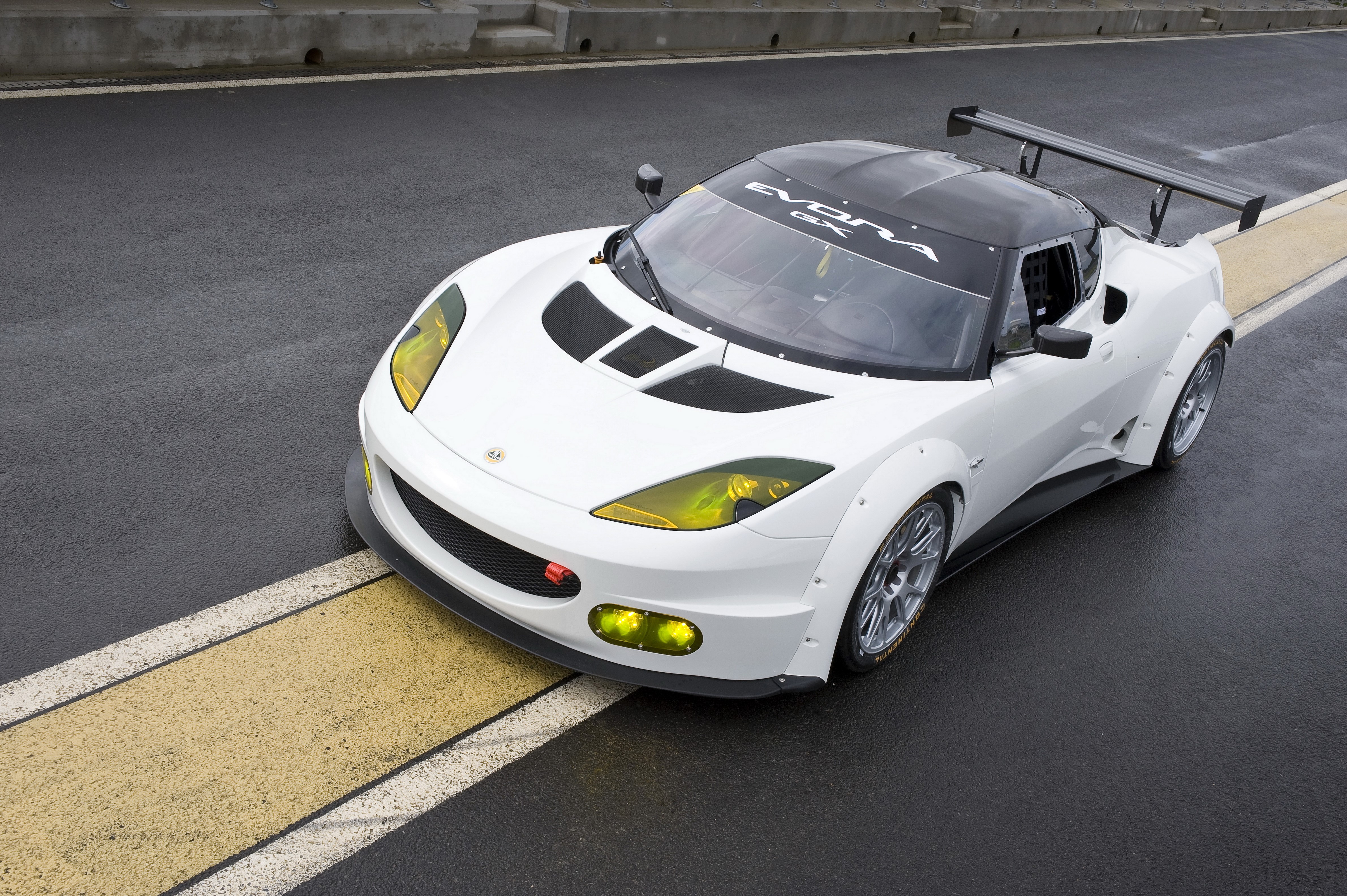 White 2012 Lotus Evora GX race car on asphalt HD Wallpaper