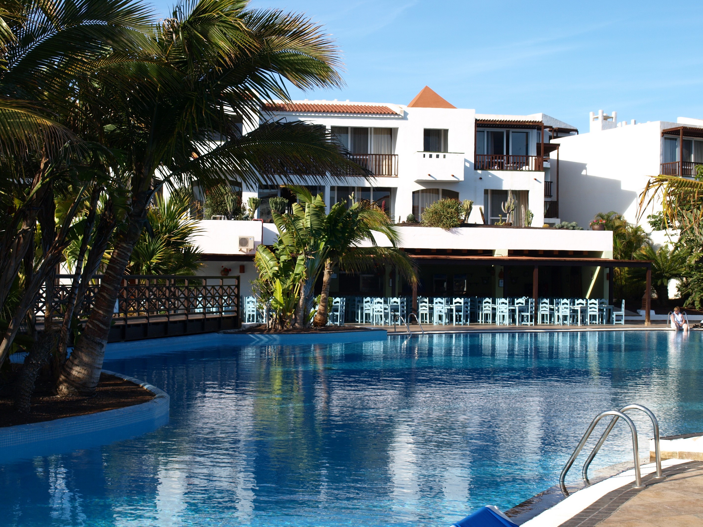 Resort with pool and palm trees in the Canary Islands, Spain HD Wallpaper