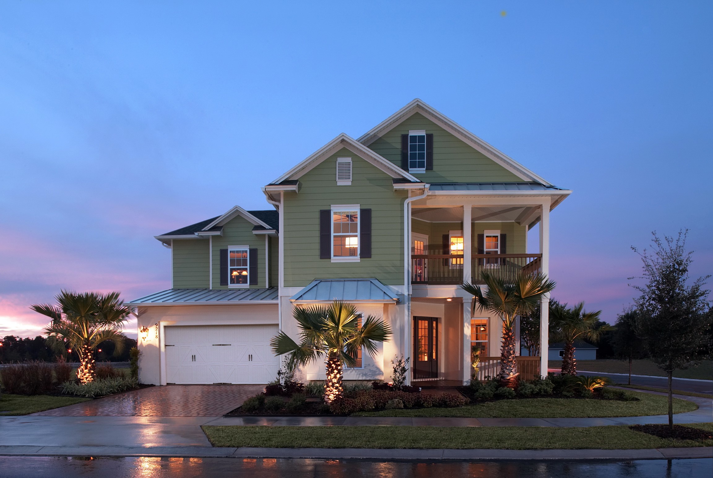 Green two-story house with a porch and garage HD Wallpaper