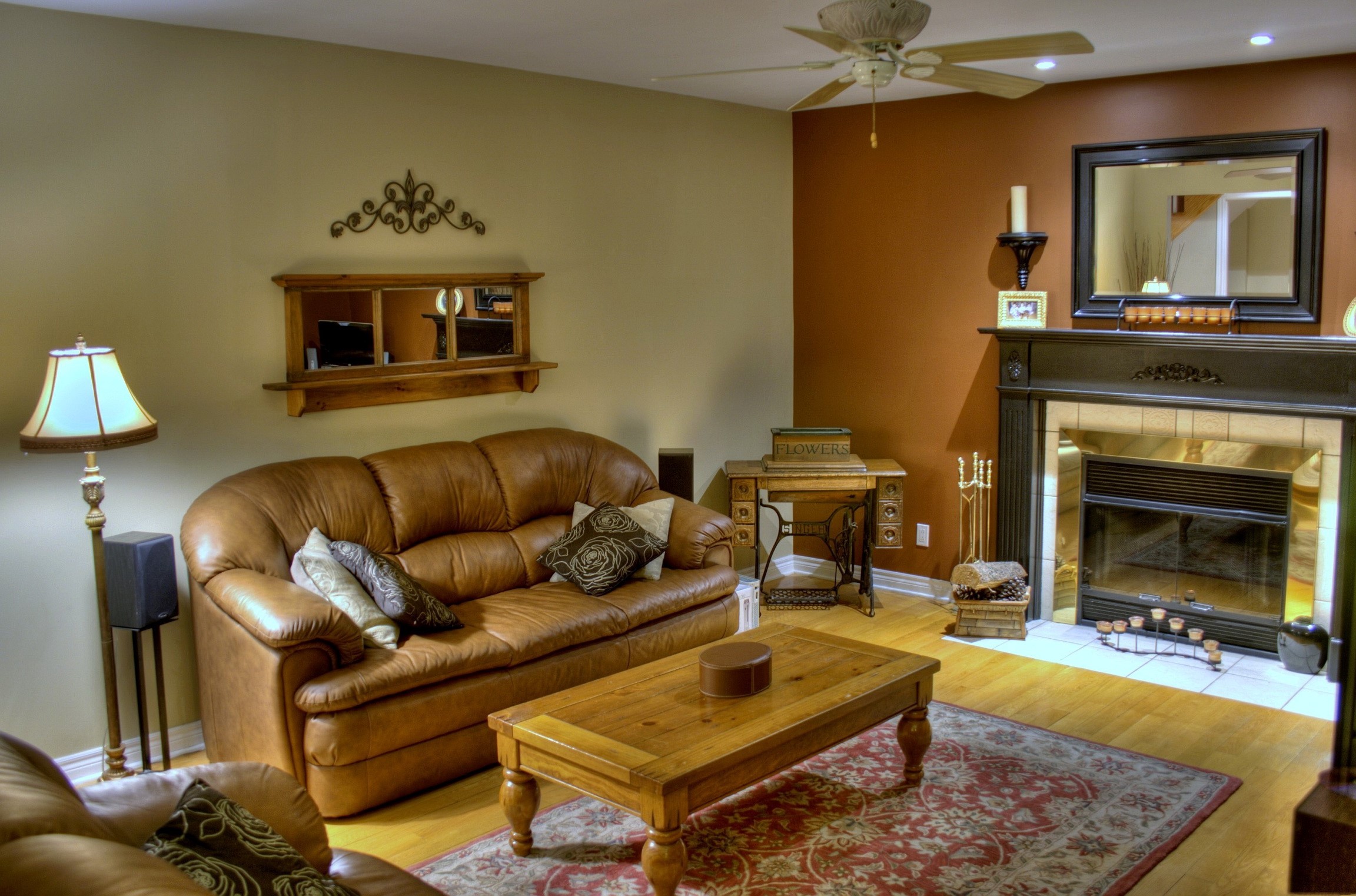 Living room with leather sofa and fireplace HD Wallpaper