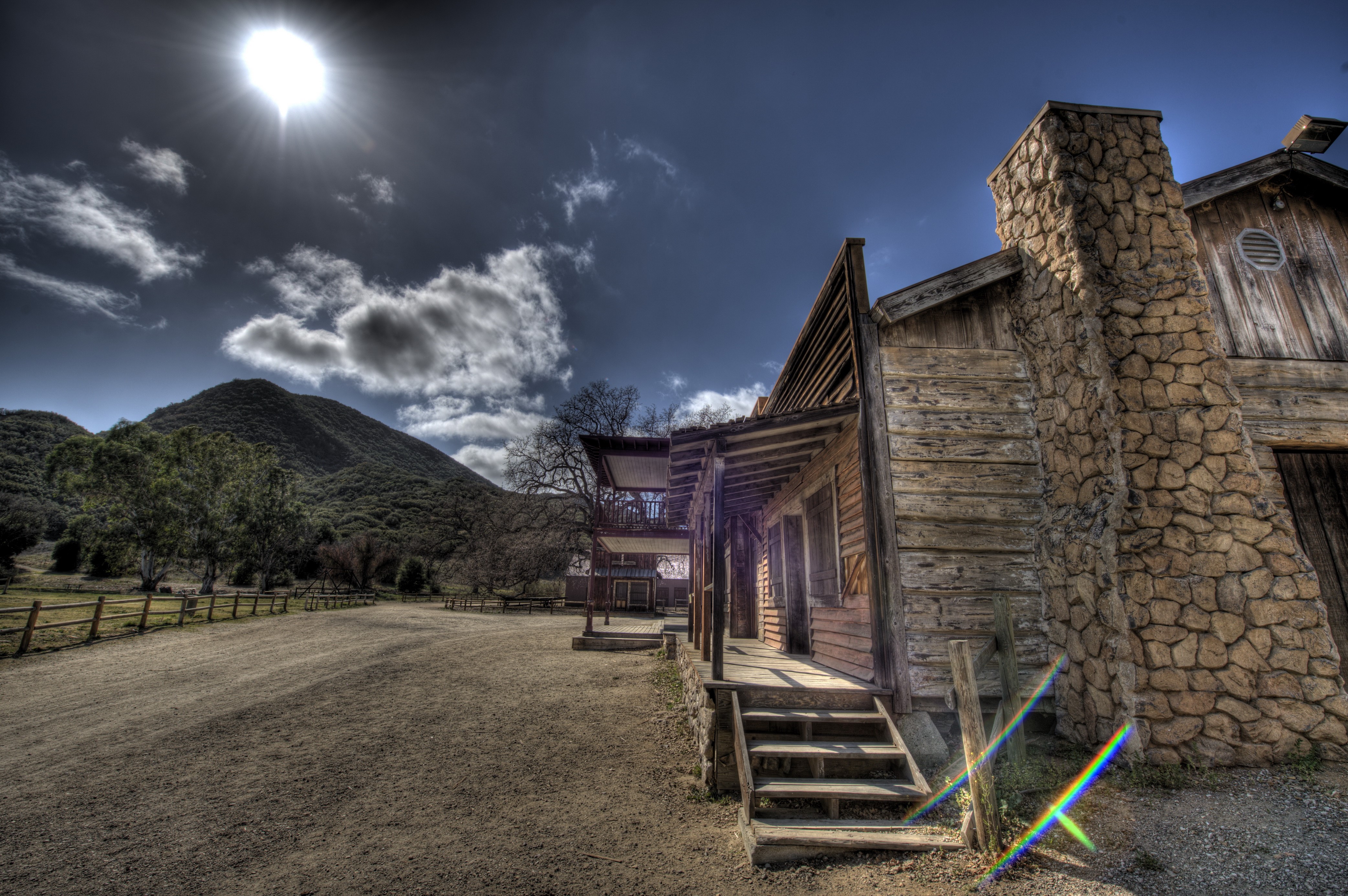 Old wooden building with stone chimney in California HD Wallpaper