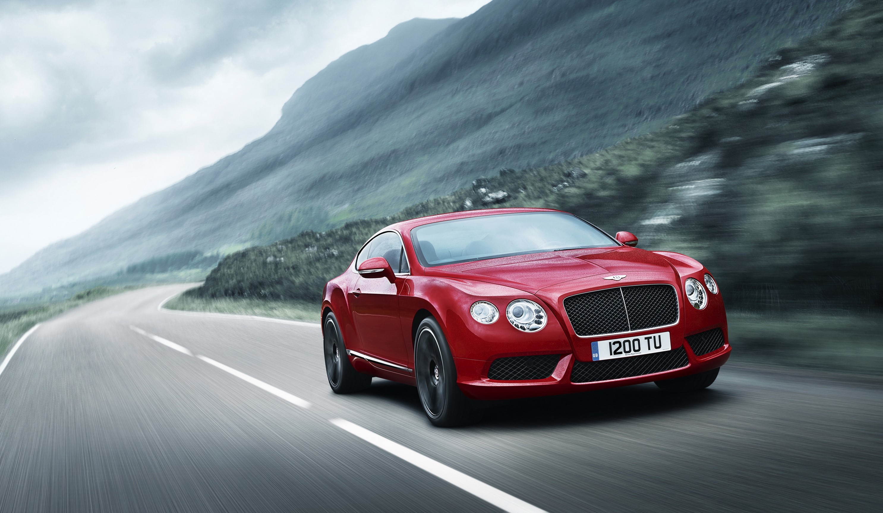 Red Bentley Continental GT V8 on a winding road HD Wallpaper