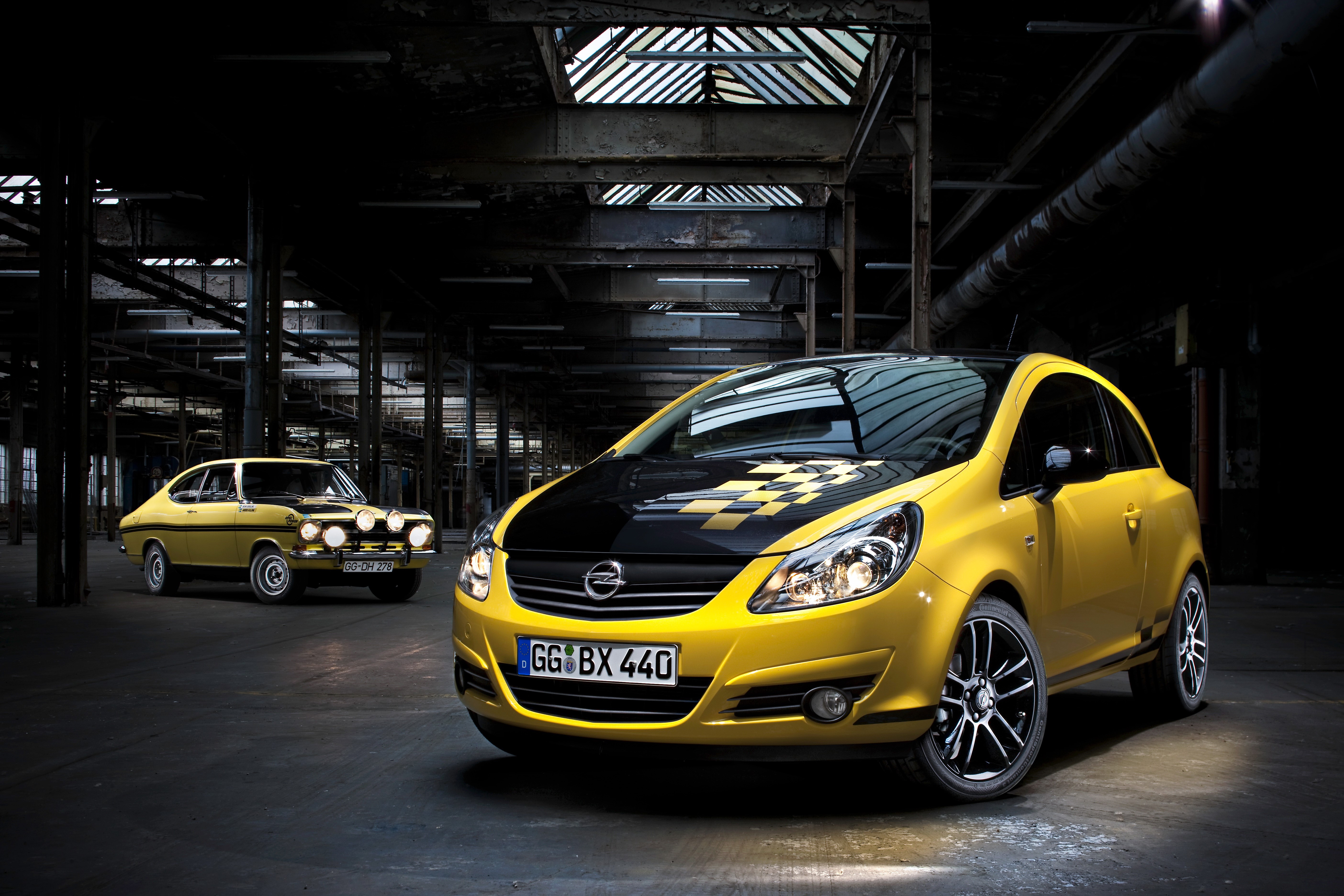 Yellow Opel Corsa and Vintage Opel in Warehouse HD Wallpaper