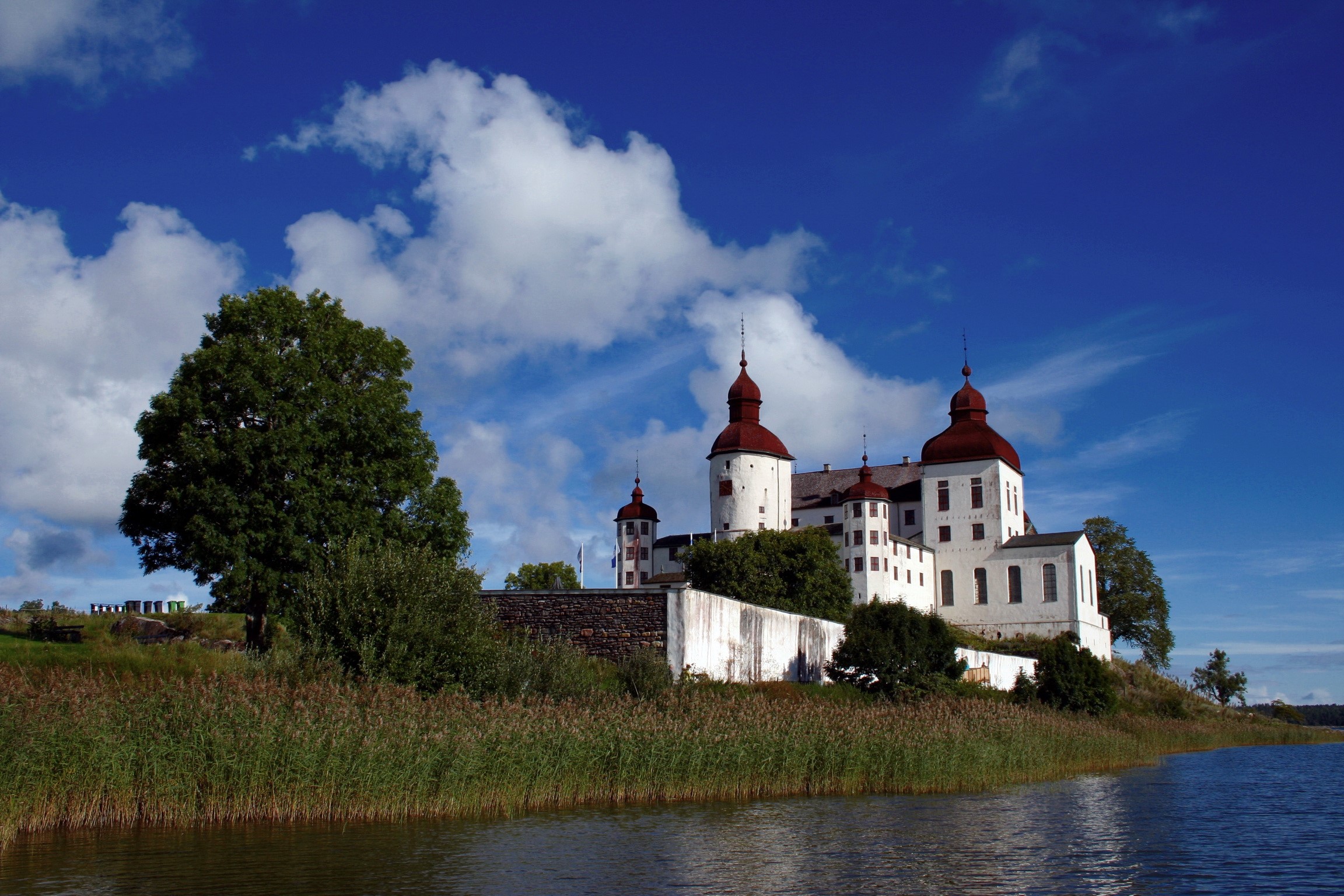 Läckö Castle, Sweden, on a sunny day with clouds HD Wallpaper