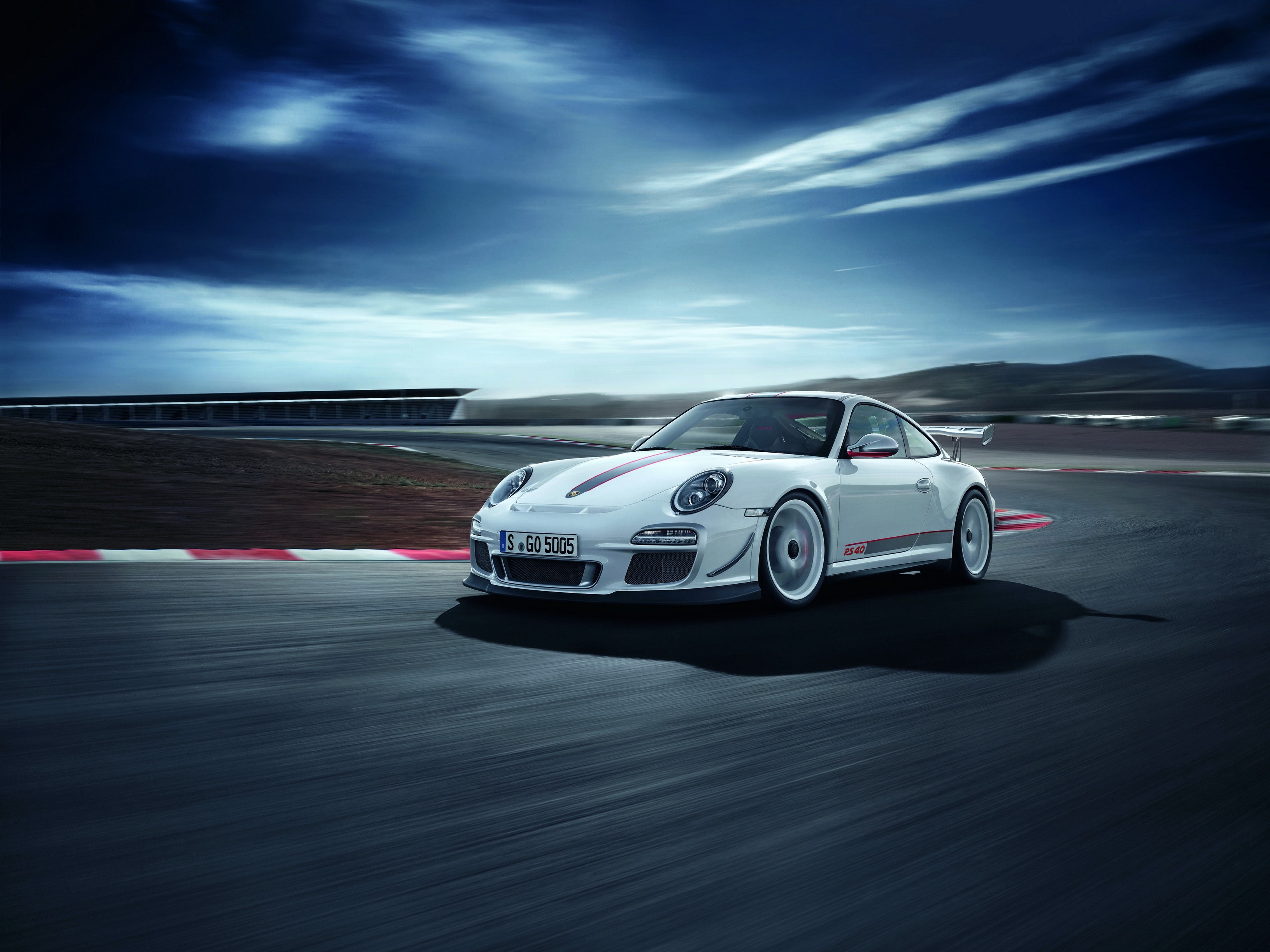 White Porsche 911 GT3 RS 4.0 on a Racetrack HD Wallpaper