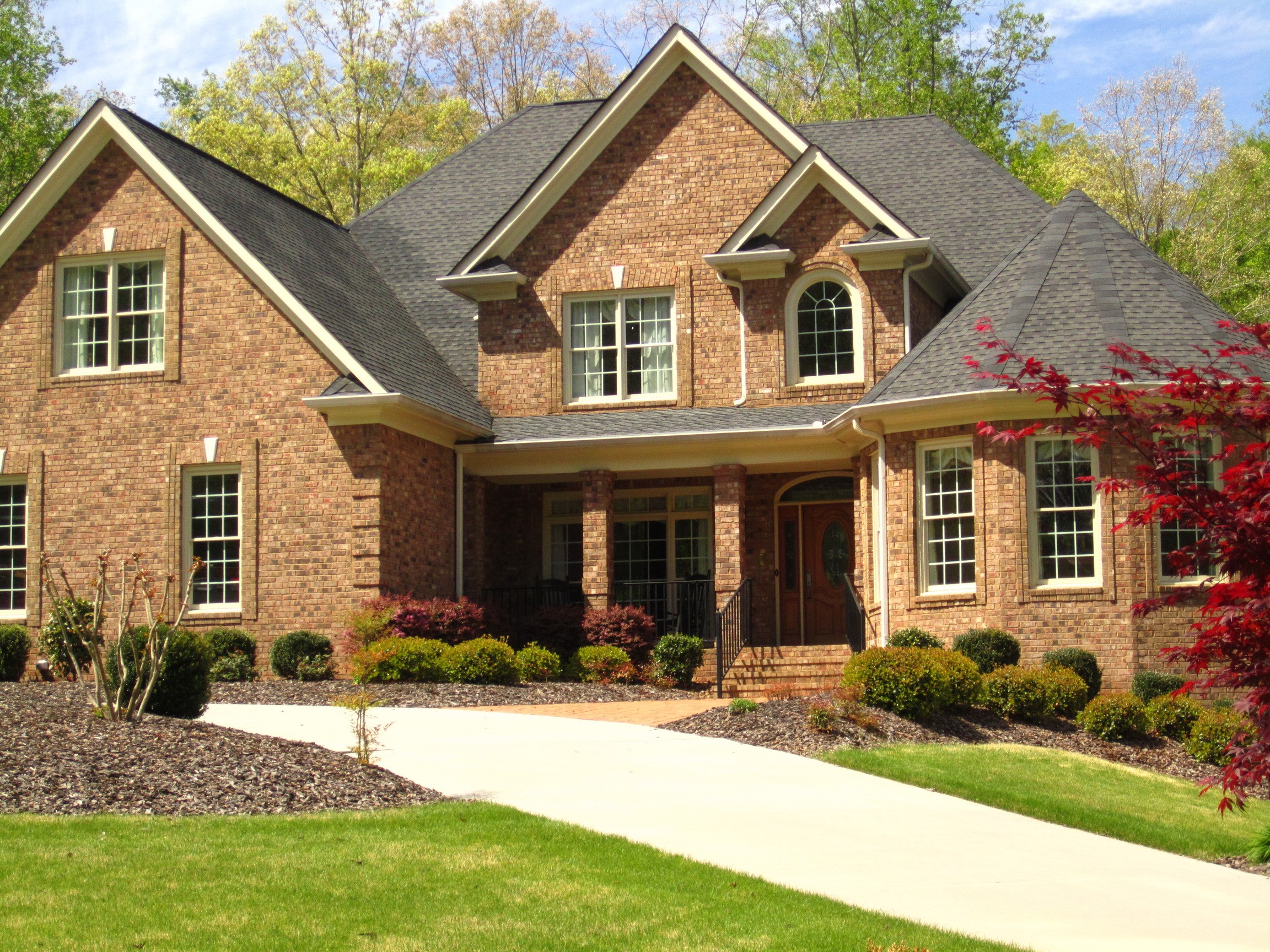 Brick House with Landscaping and Driveway HD Wallpaper