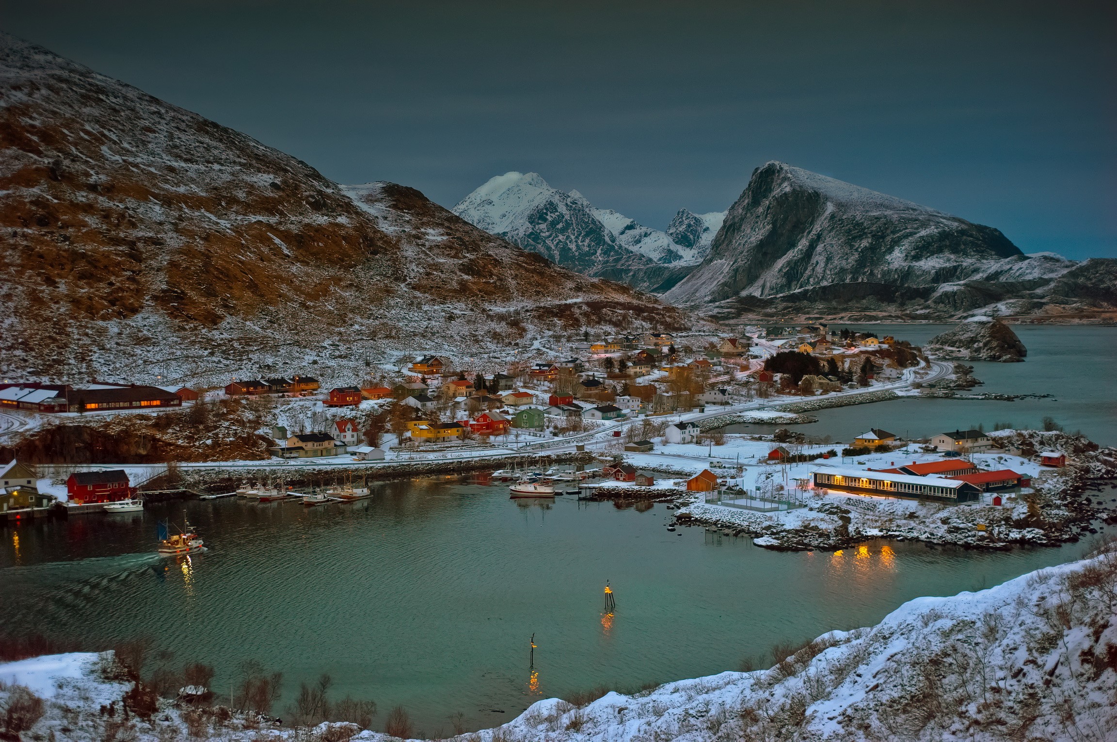 Snowy Norwegian village with mountains and a harbor HD Wallpaper