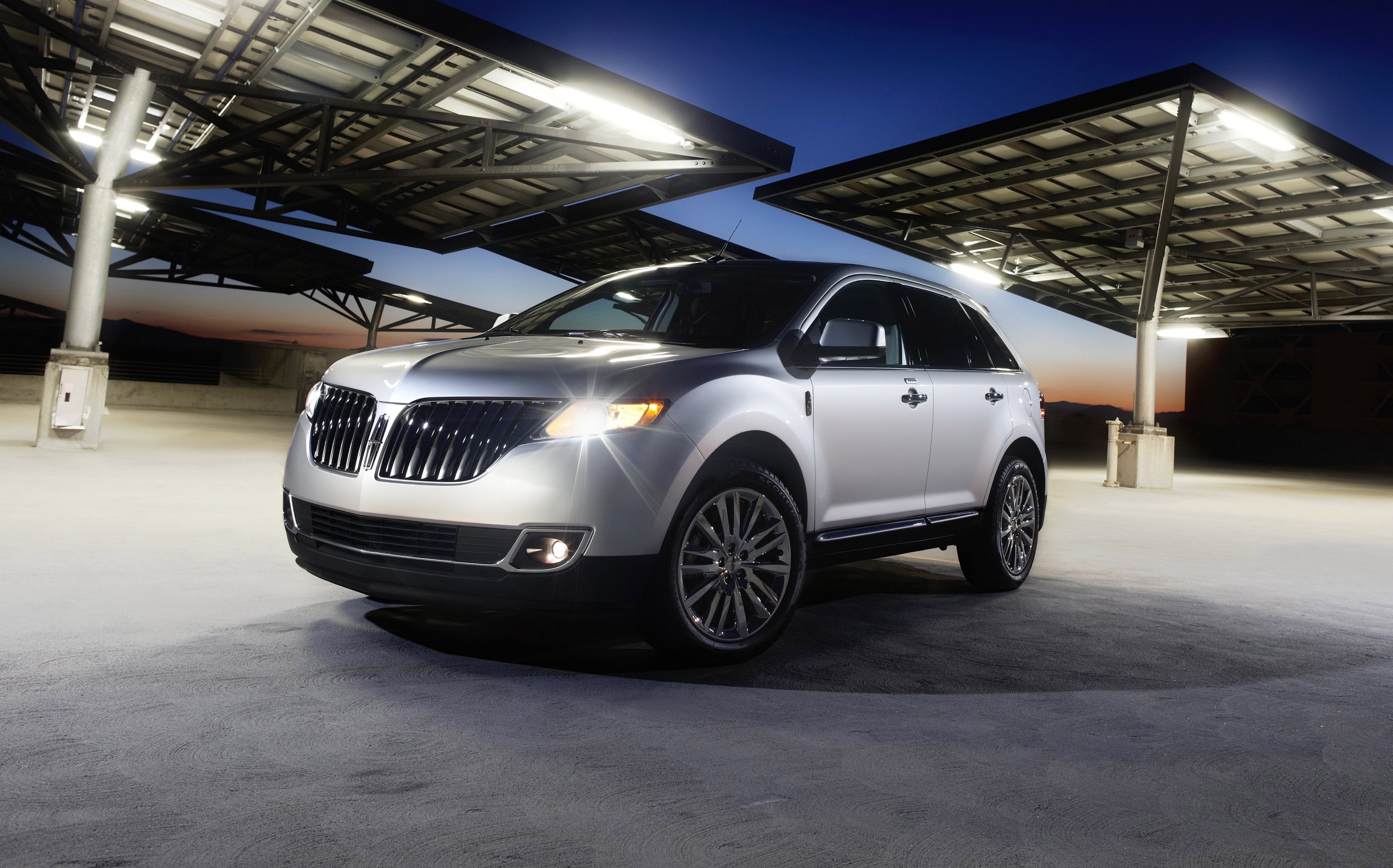 2011 Lincoln MKX parked under solar panel canopy HD Wallpaper