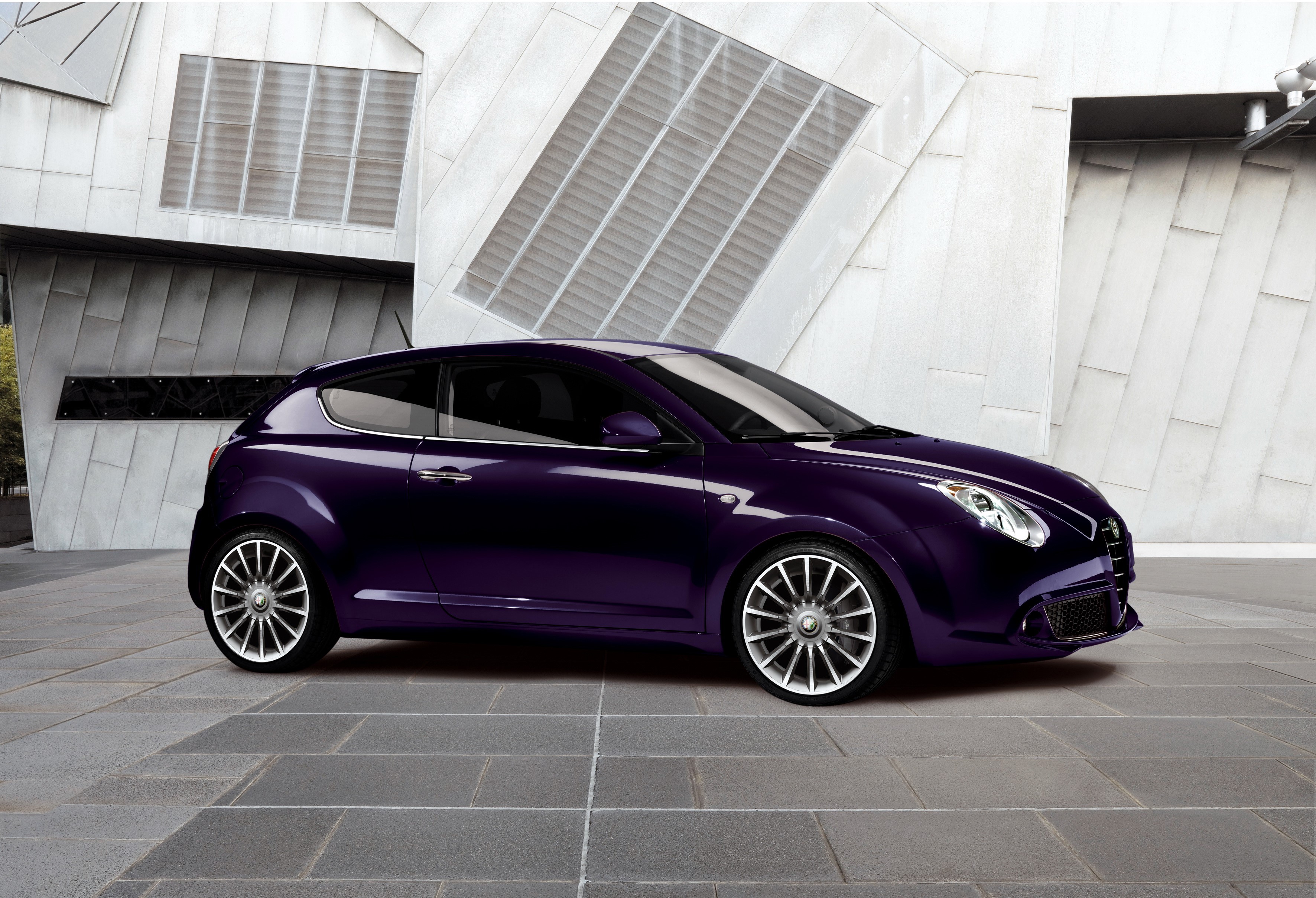 Violet Alfa Romeo MiTo 0.9 TwinAir parked outside modern building HD Wallpaper