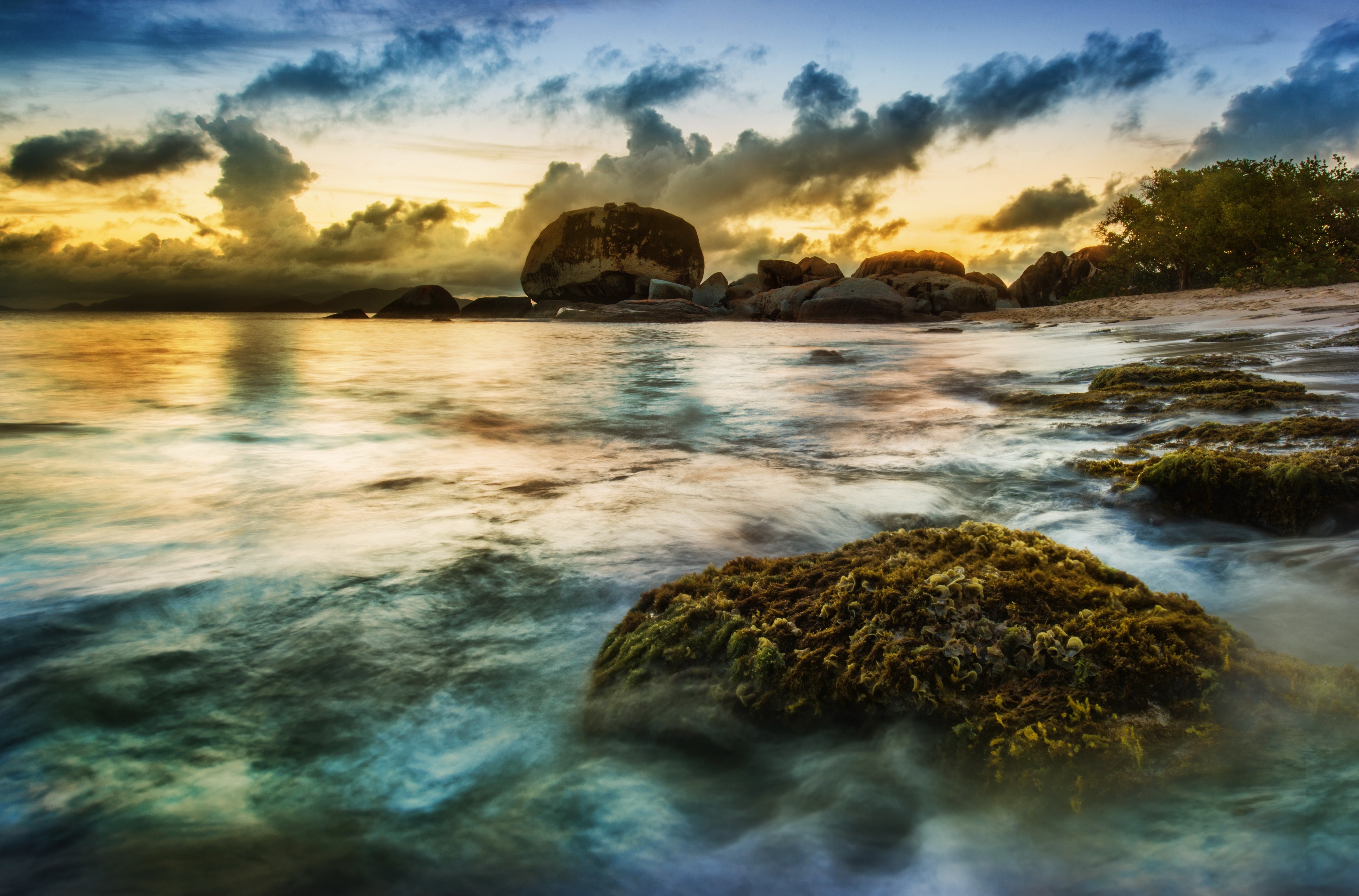 Rocky Coastline at Sunset with Dramatic Clouds HD Wallpaper