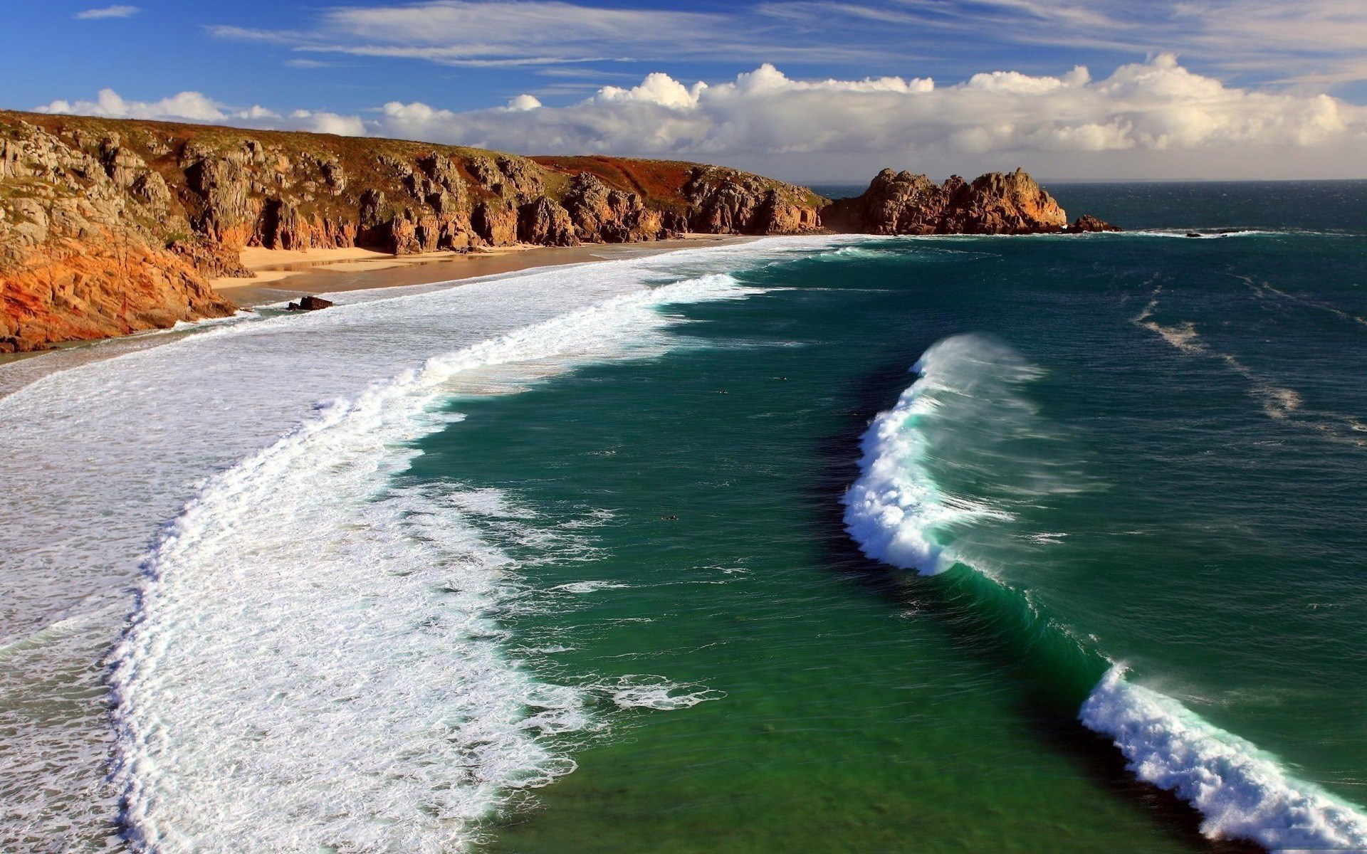 Coastal cliffs and ocean waves under a cloudy sky HD Wallpaper