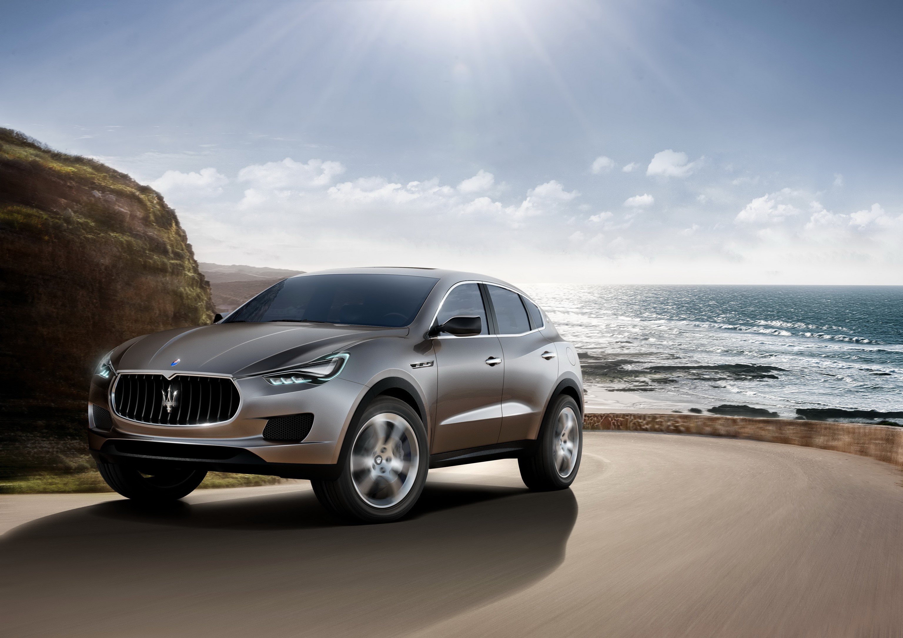 Maserati Kubang concept SUV on coastal road HD Wallpaper