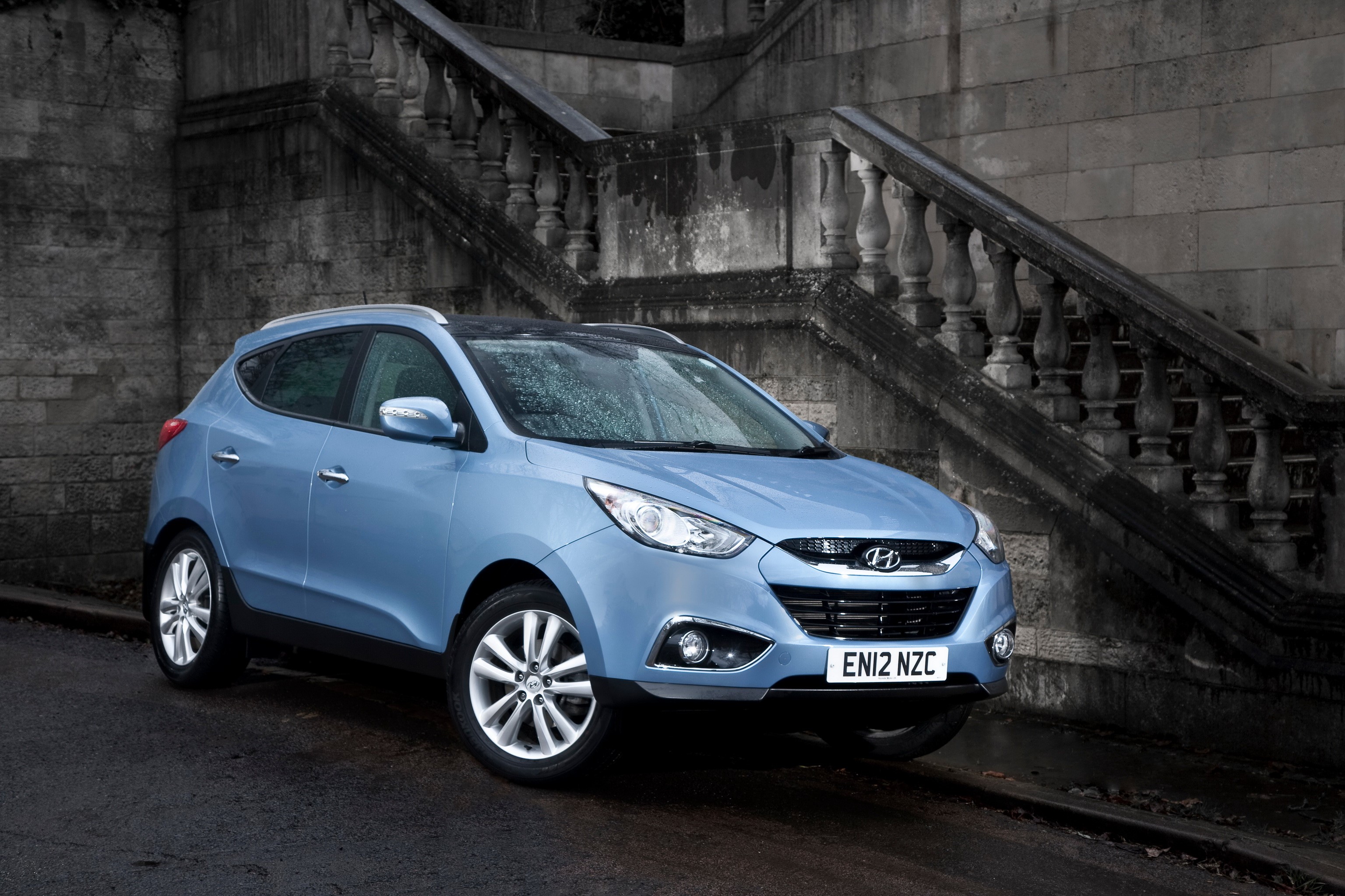 Light blue Hyundai ix35 parked near stone stairs HD Wallpaper