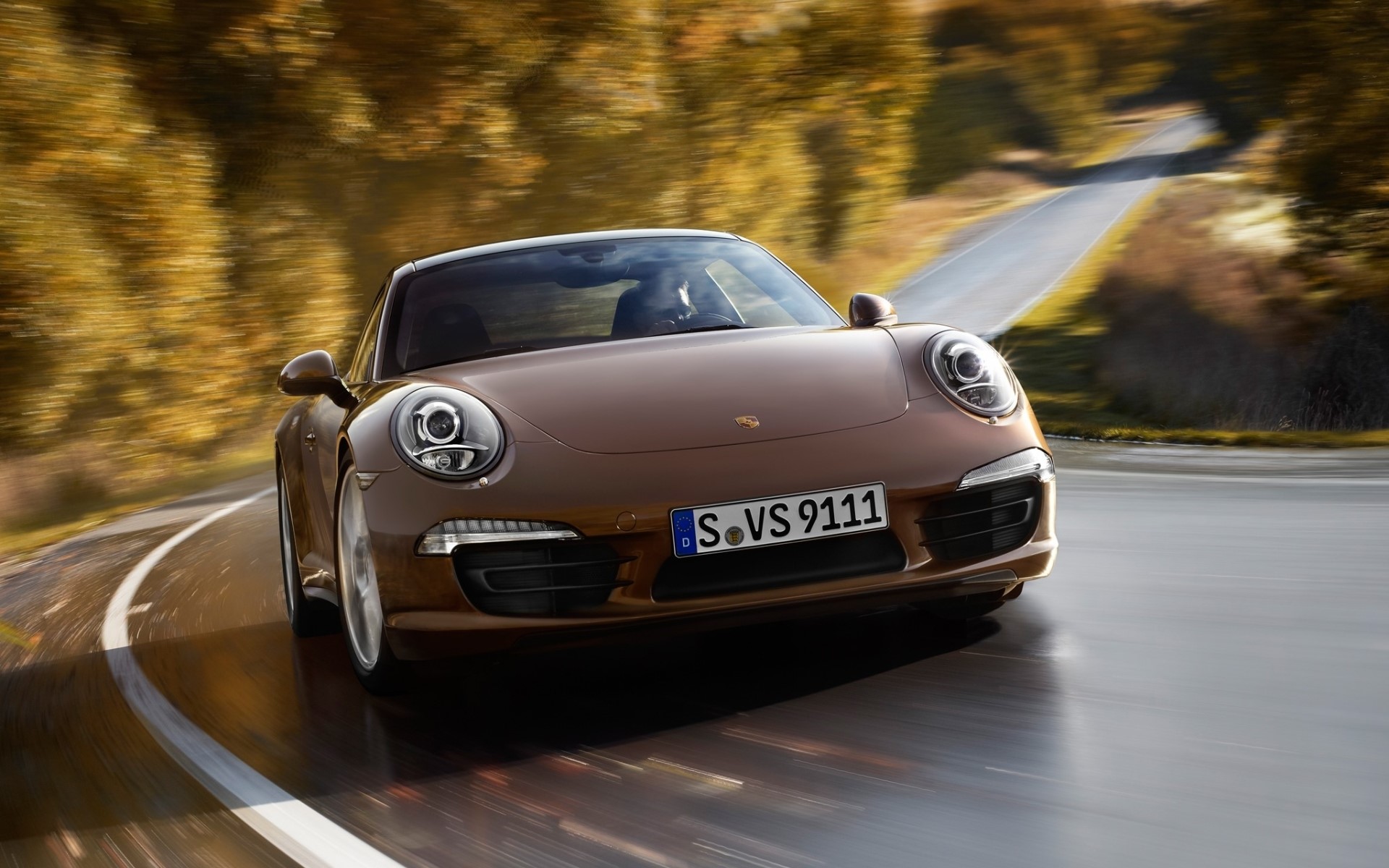 Brown Porsche 911 driving on a winding road HD Wallpaper