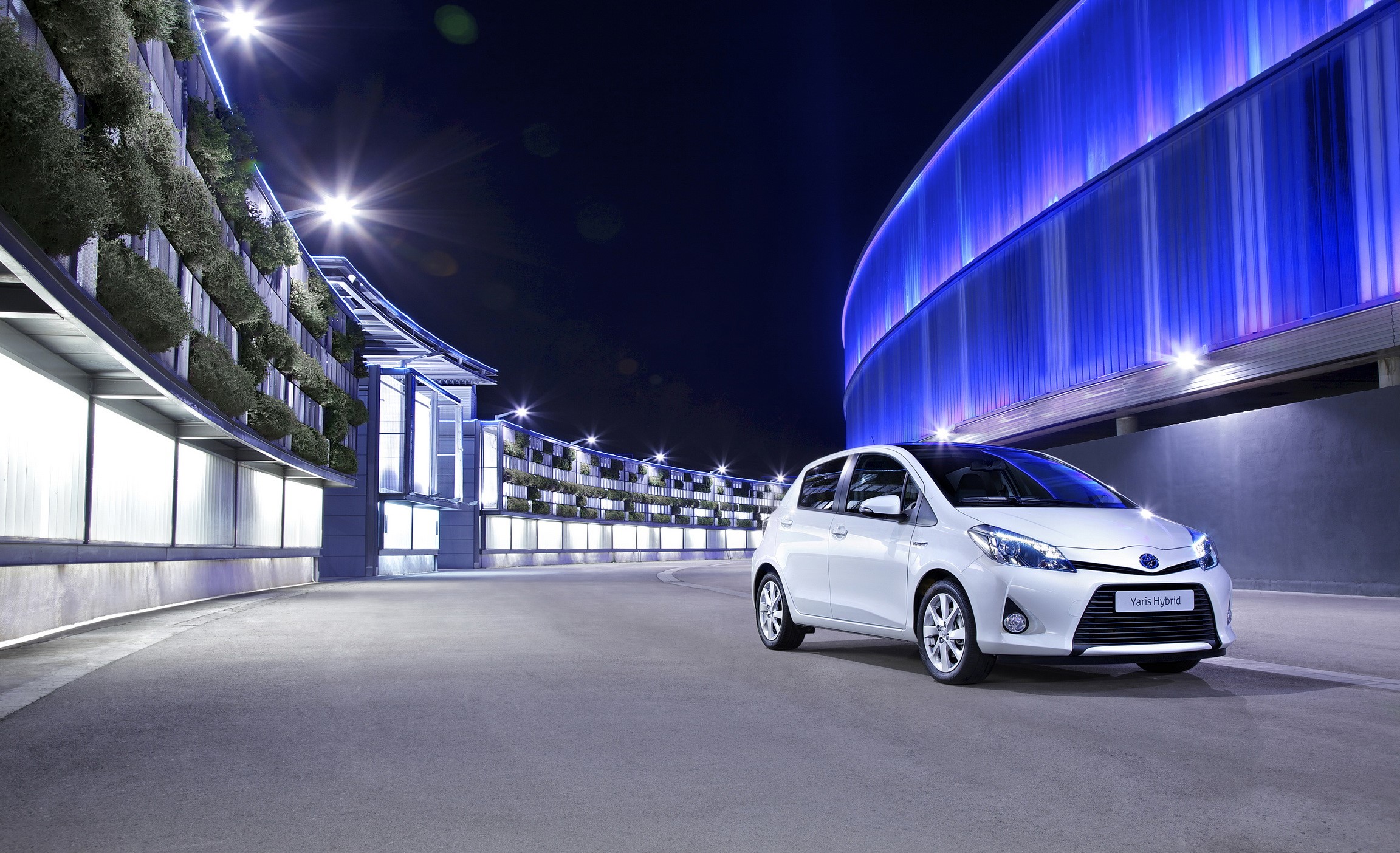 White 2012 Toyota Yaris Hybrid at Night HD Wallpaper