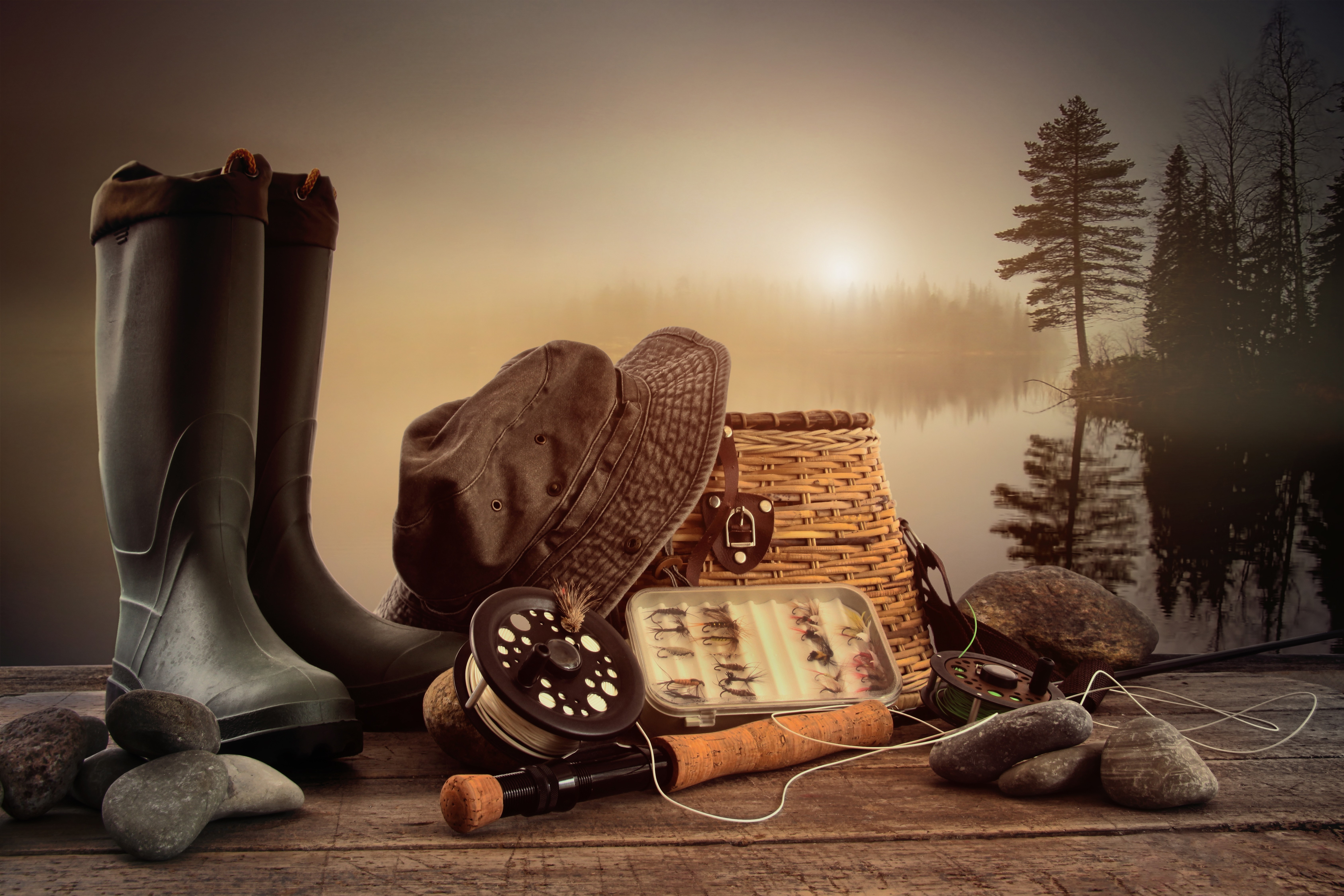 Fishing gear and boots by a lake HD Wallpaper