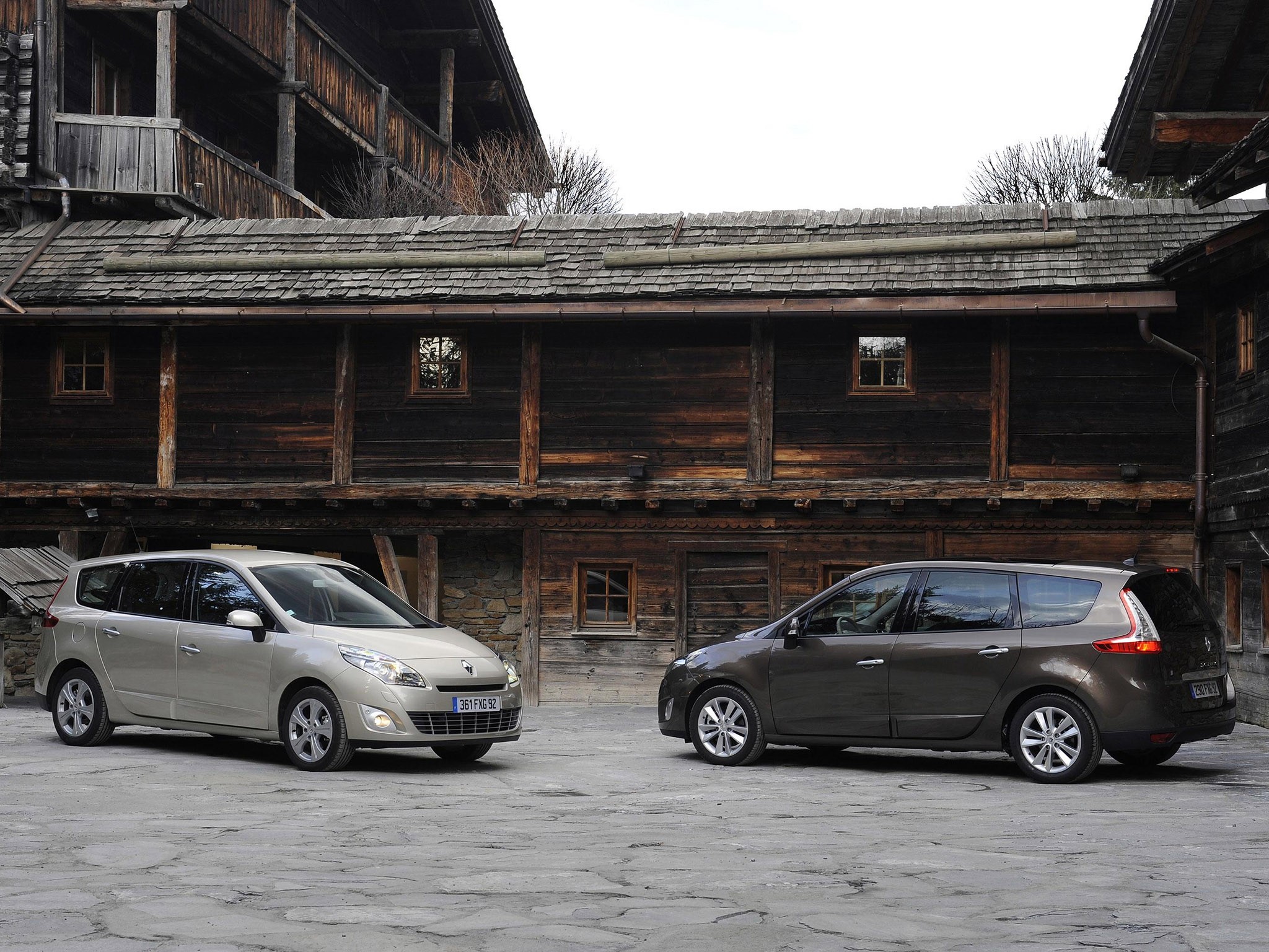 2009 Renault Grand Scenic cars in front of wooden houses HD Wallpaper