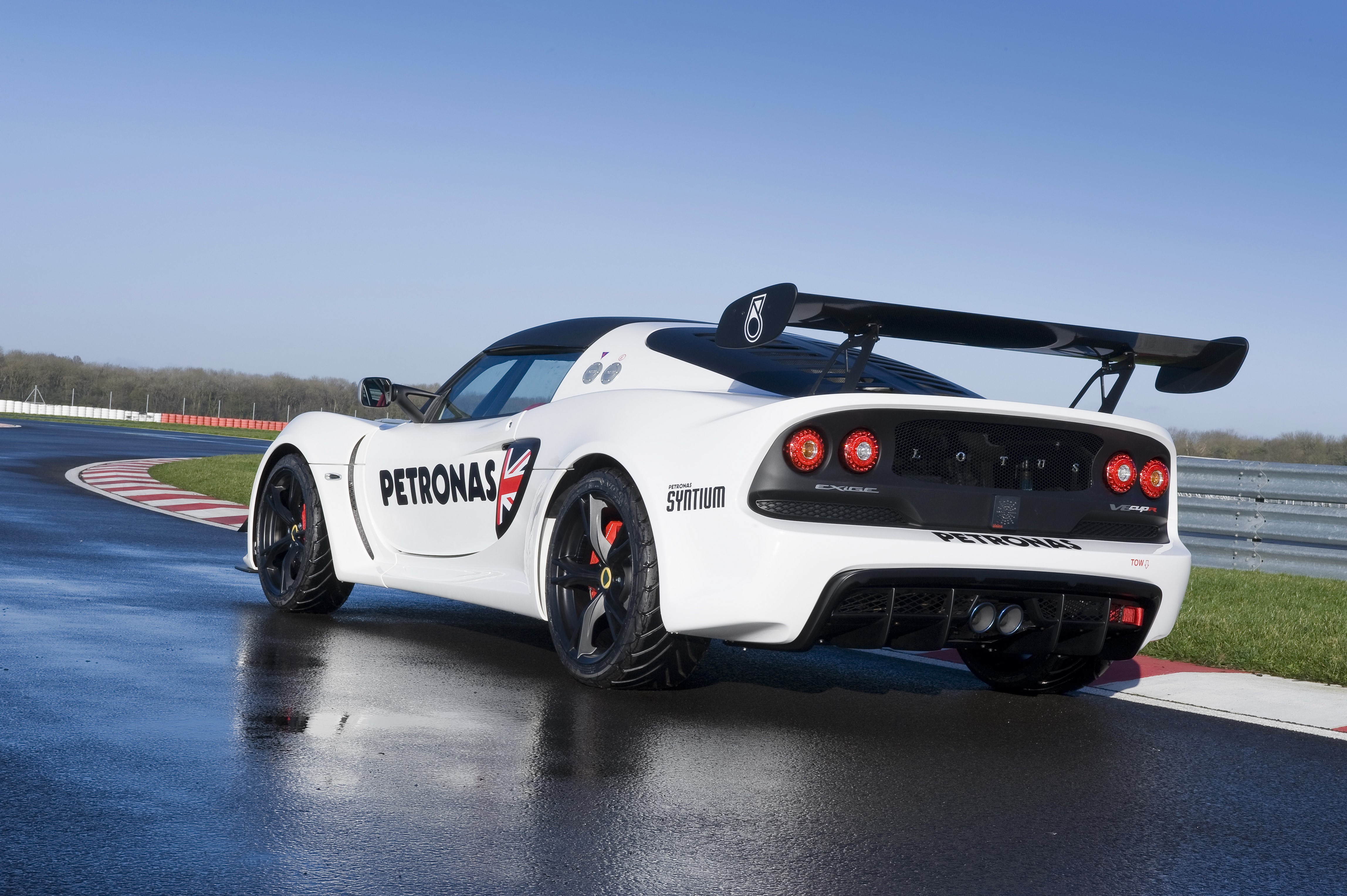 White Lotus 2013 Exige V6 Cup R on a wet race track HD Wallpaper